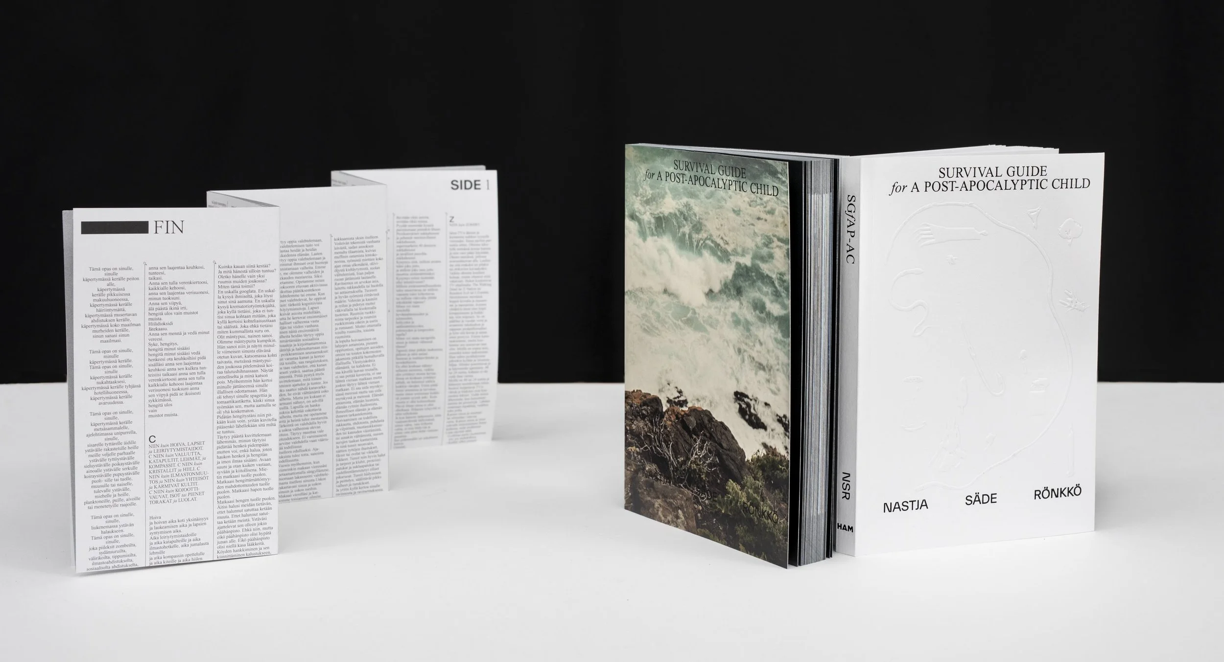 Open book titled 'Survival Guide for a Post-Apocalyptic Child' with a sea and rocky landscape on the cover, and scattered pages with text in various languages against a black background.