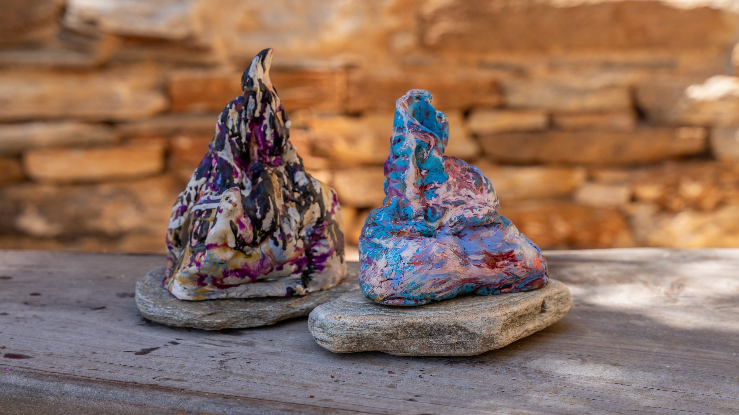 Finnish artist Satu Metsola's two small scale sculptures "Unseen Mountain" series, pictured outdoors in Greek island Andros