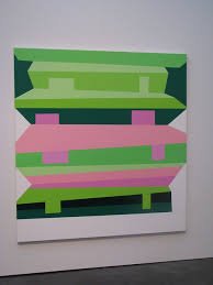 Abstract pixel art with green, pink, and dark blue shapes on a white background.
