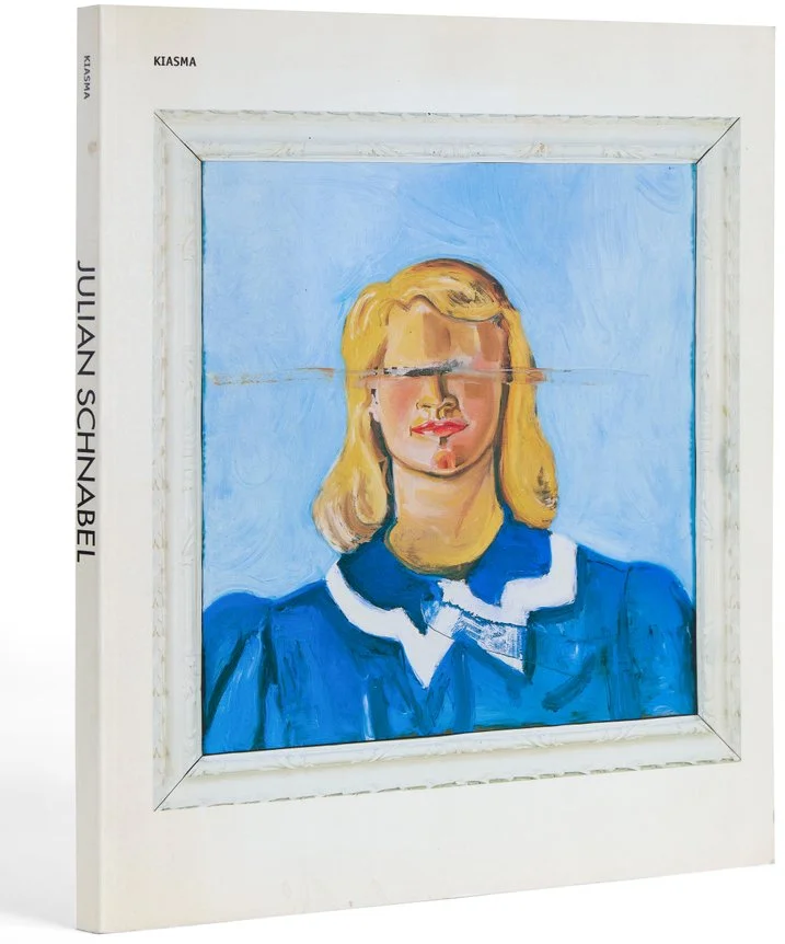 A framed painting of a woman with blonde hair and wearing a blue outfit, with a distorted face that appears to be split horizontally, creating a warped effect.