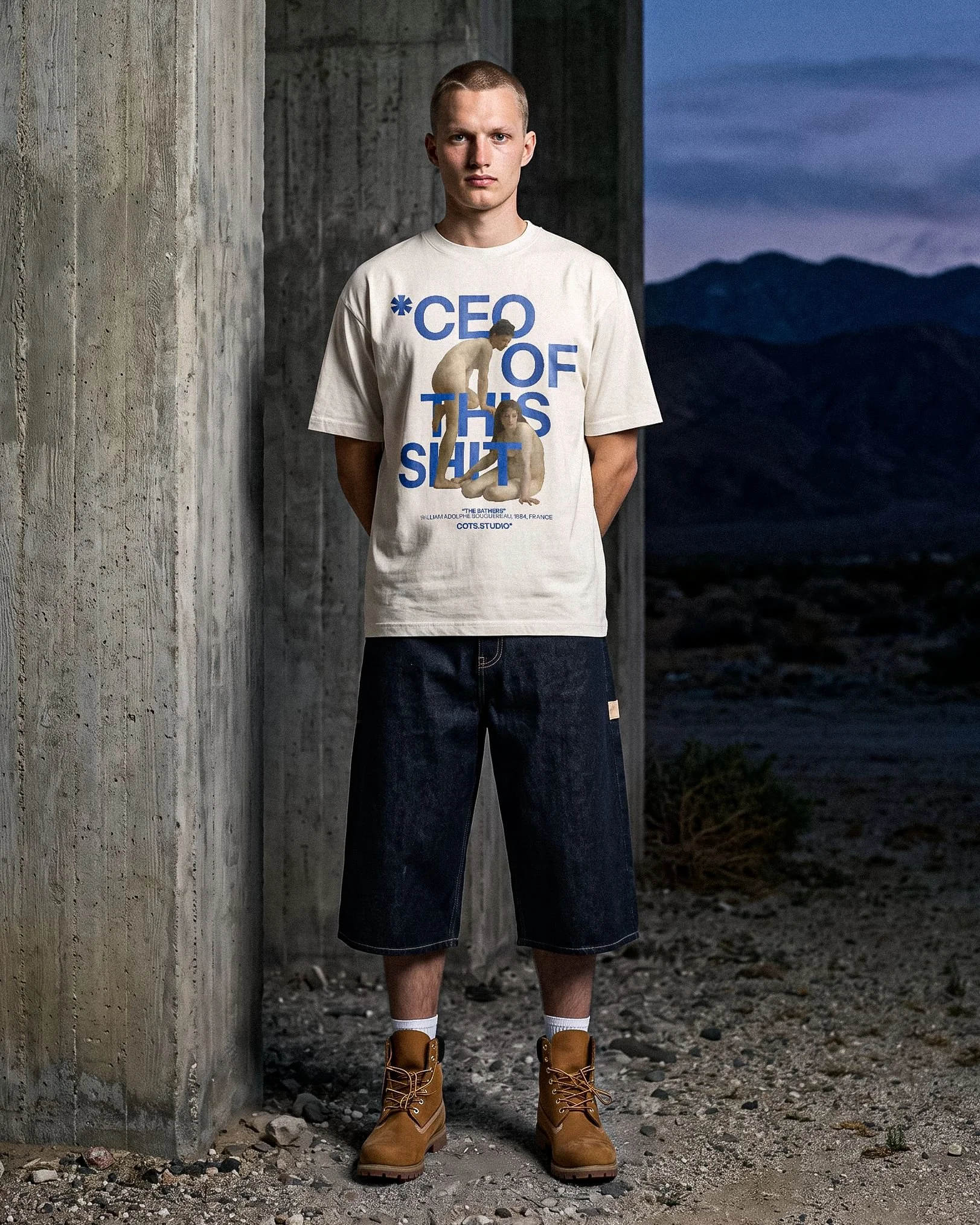 BATHERS TEE COTS.STUDIO indossata, vista frontale con grafica The Bathers e lettering blu