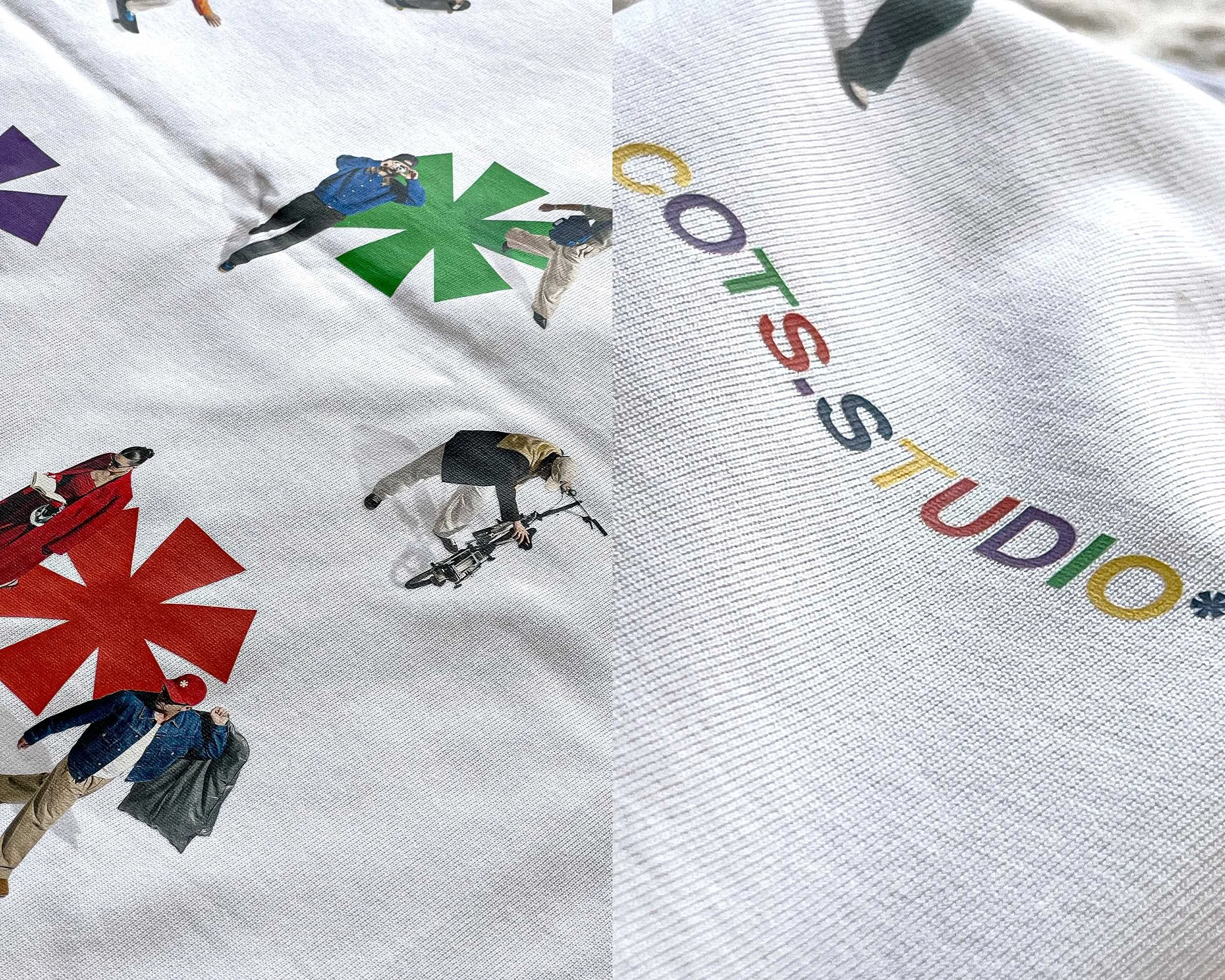 Dettaglio dell'artwork posteriore della EVERYONE TEE con figure, asterischi e logo COTS.STUDIO multicolore