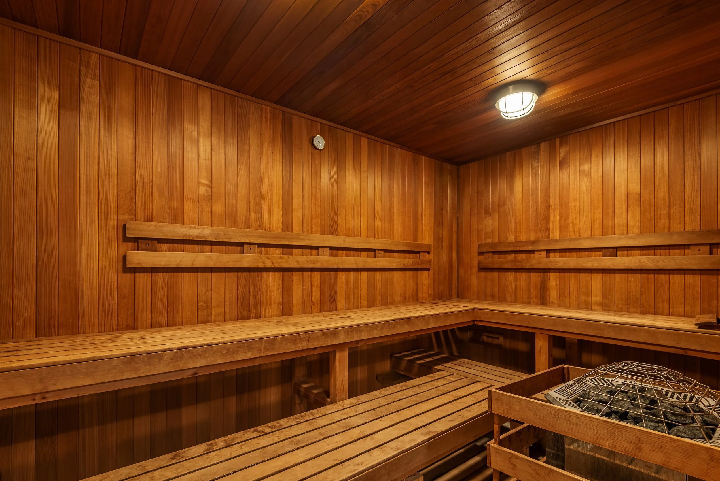 Wood-lined sauna at The Addison senior living community wellness spa