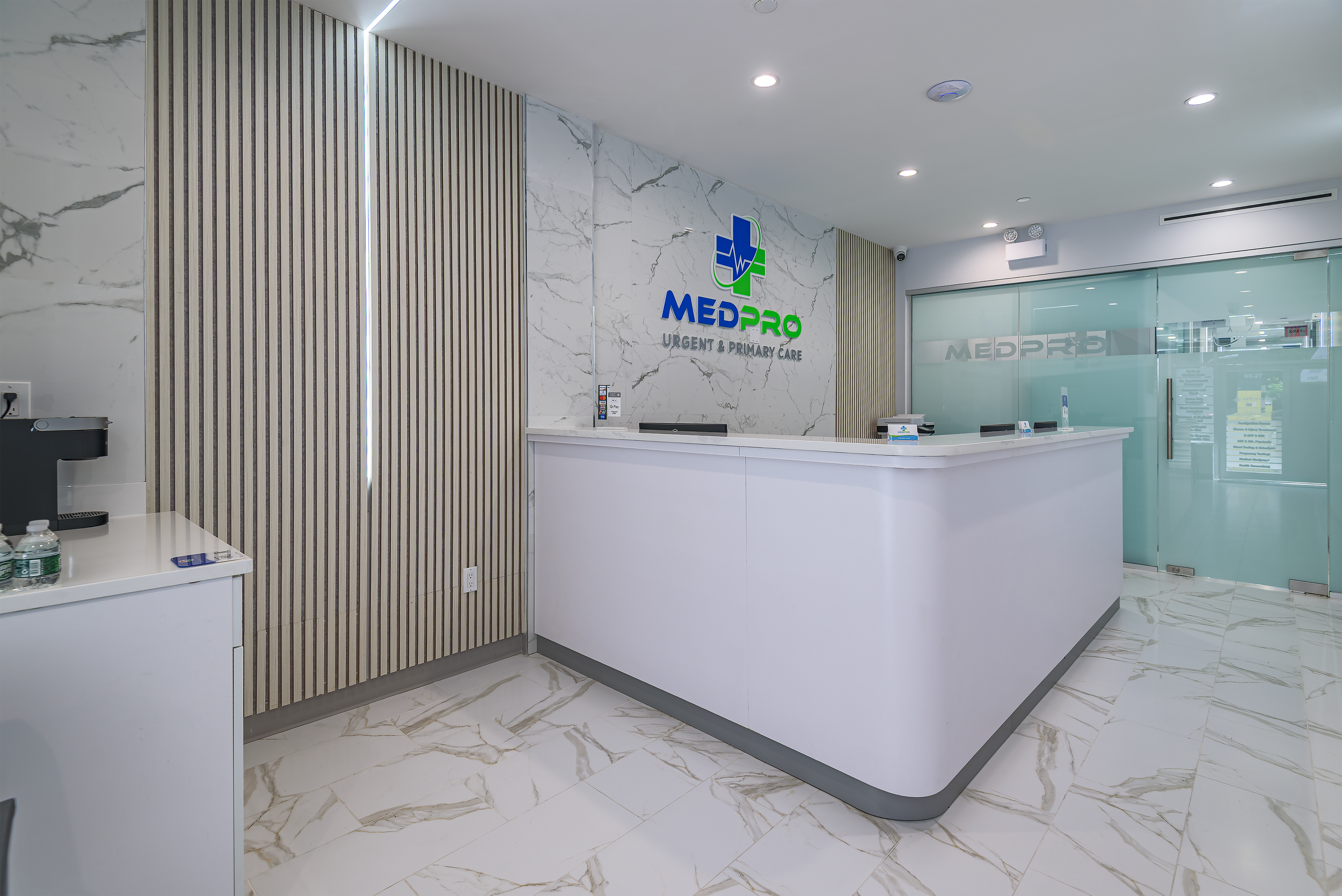 Minimalist medical office reception featuring marble finishes and custom lighting, captured as architectural interior photography in NYC.