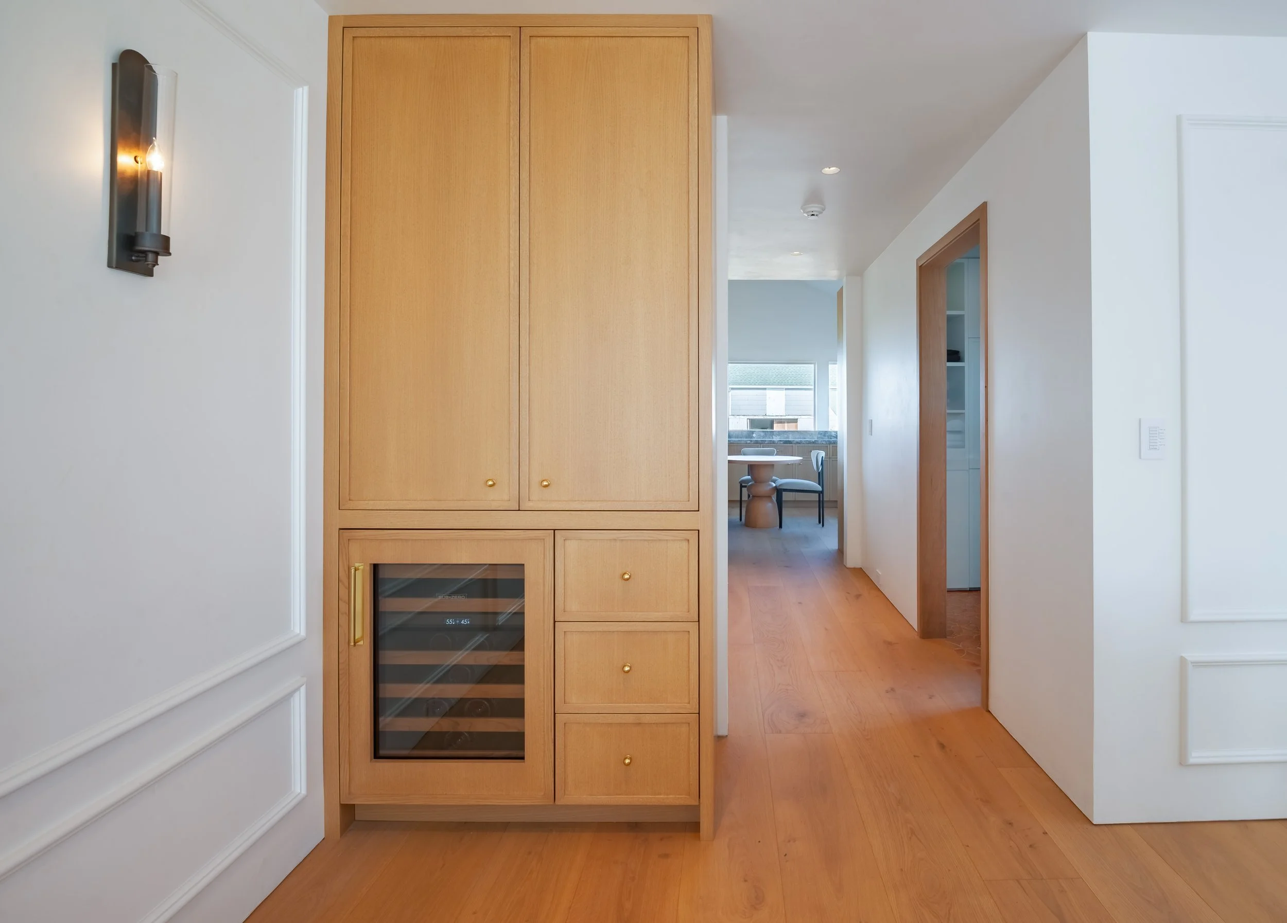 07-north-fork-gut-renovation-custom-white-oak-built-in-wine-fridge.jpg