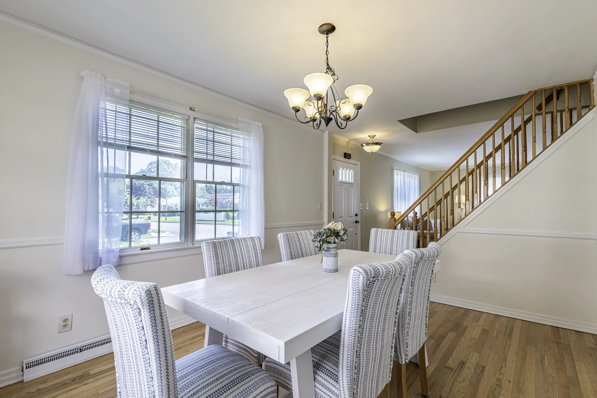 dining-room-with-staircase-and-formal-seating.jpg