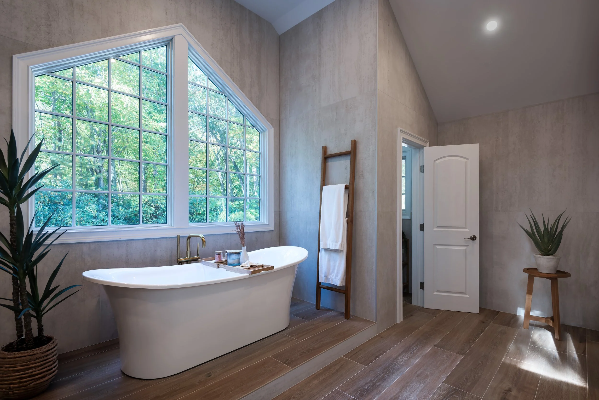Warm, modern luxury bathroom interior photographed with a focus on natural light, architectural detail, and spatial composition for residential design portfolios in NYC and Long Island.