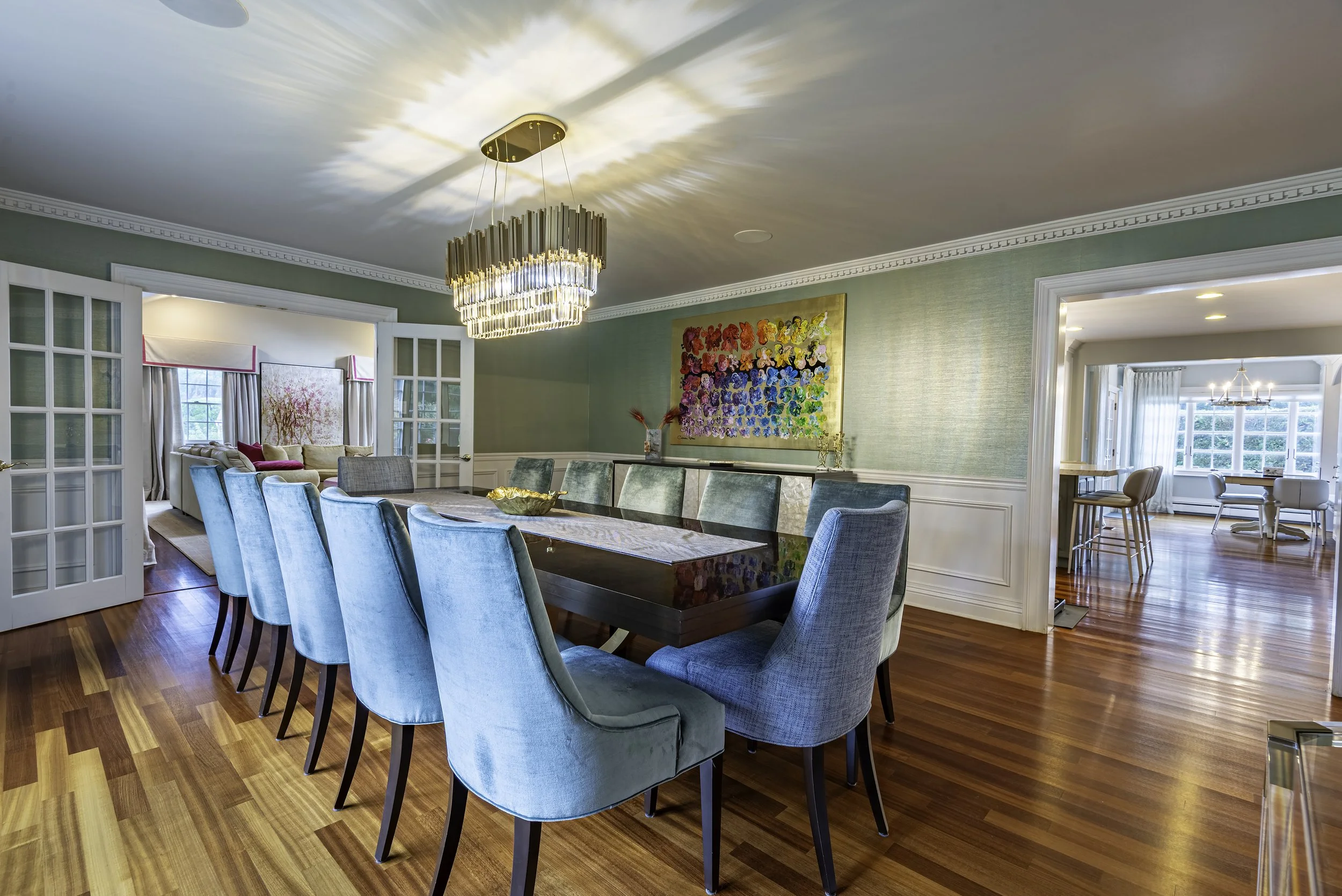 Luxury dining room real estate interior photography showcasing elegant seating, large windows, natural lighting, and modern staging in New York.