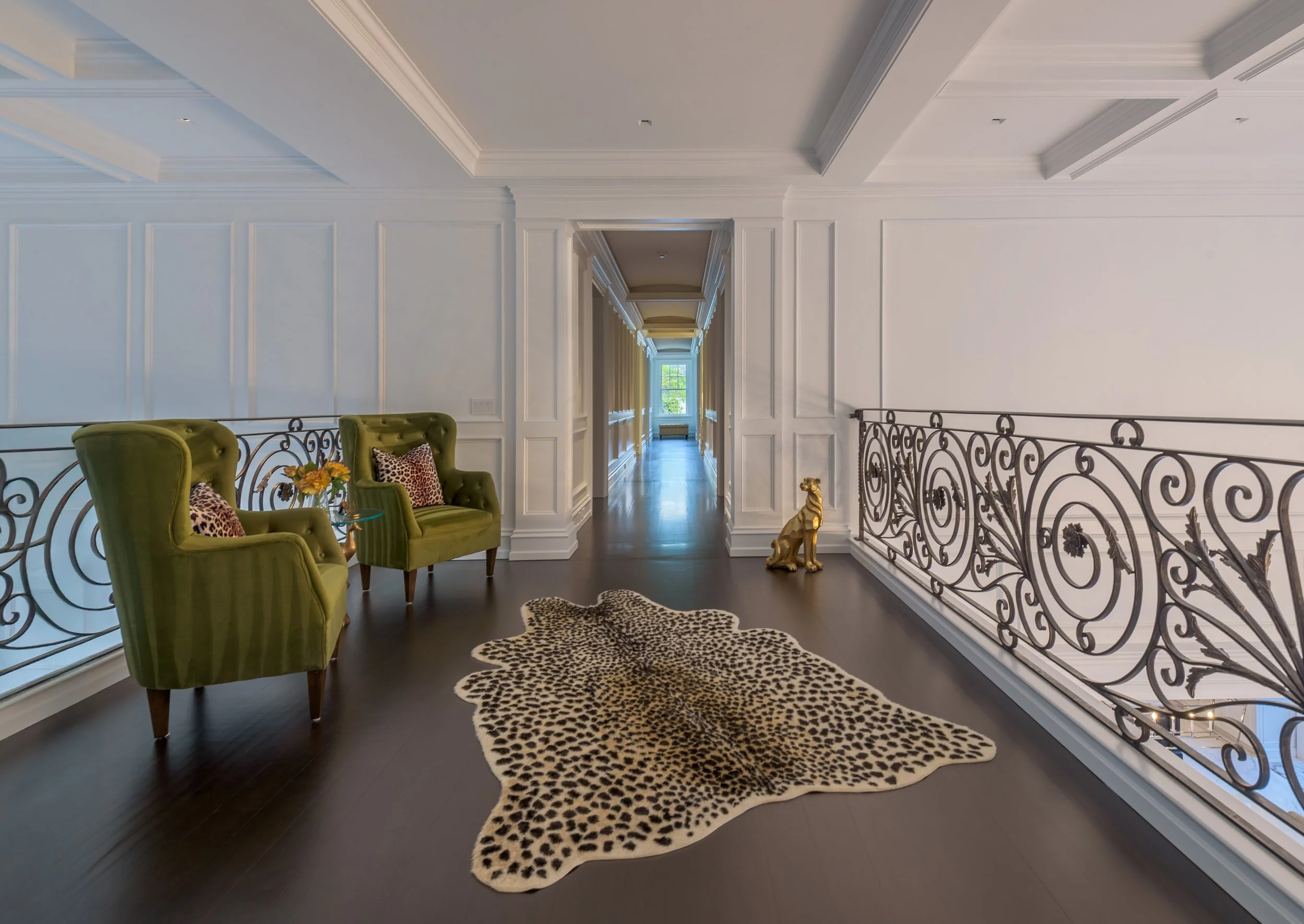 Luxury architectural interior featuring a symmetrical hallway, decorative balcony railing, and refined residential design details.”