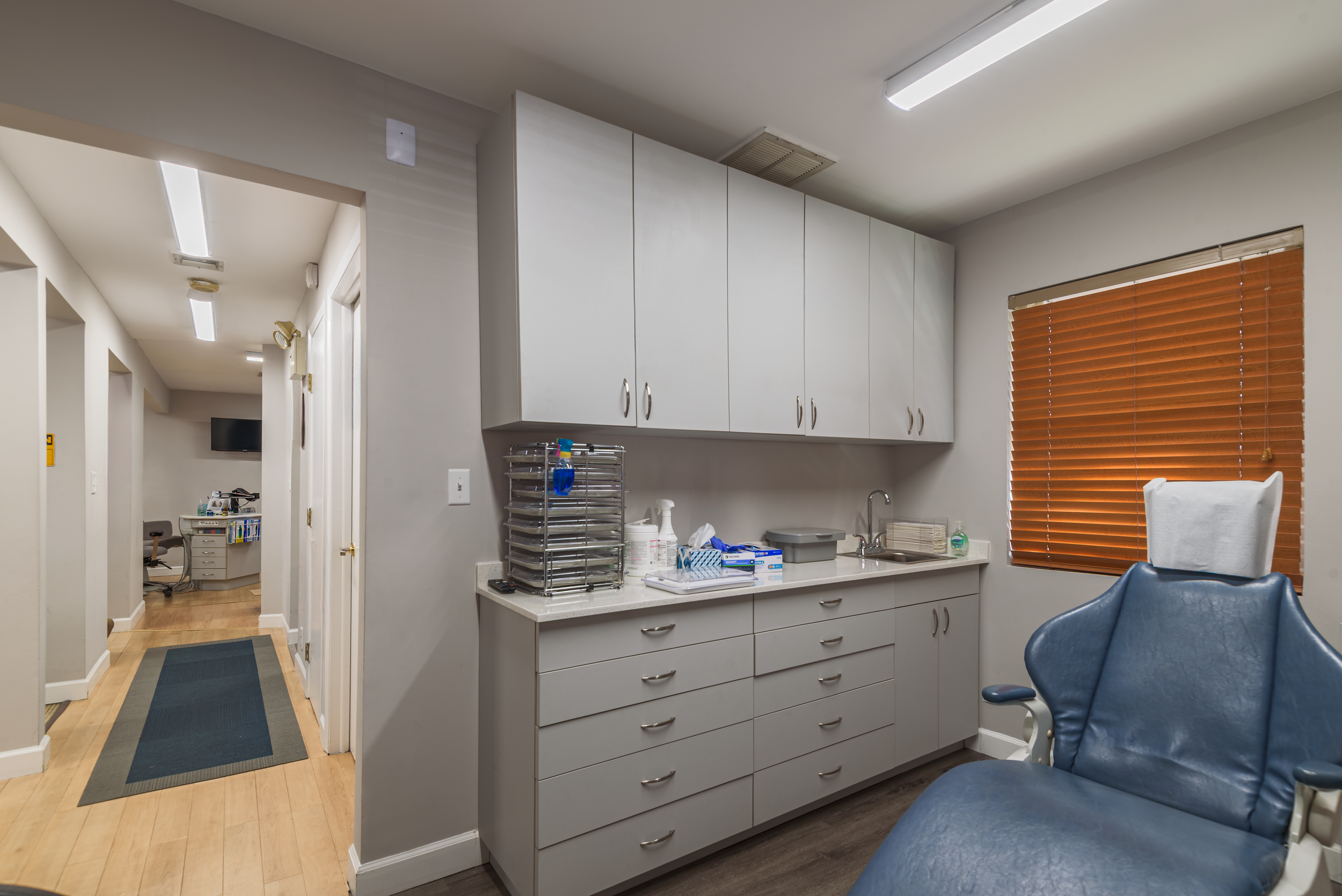 Dental office treatment room interior showcasing clinical cabinetry and layout, photographed for commercial and architectural use in Queens, NYC.