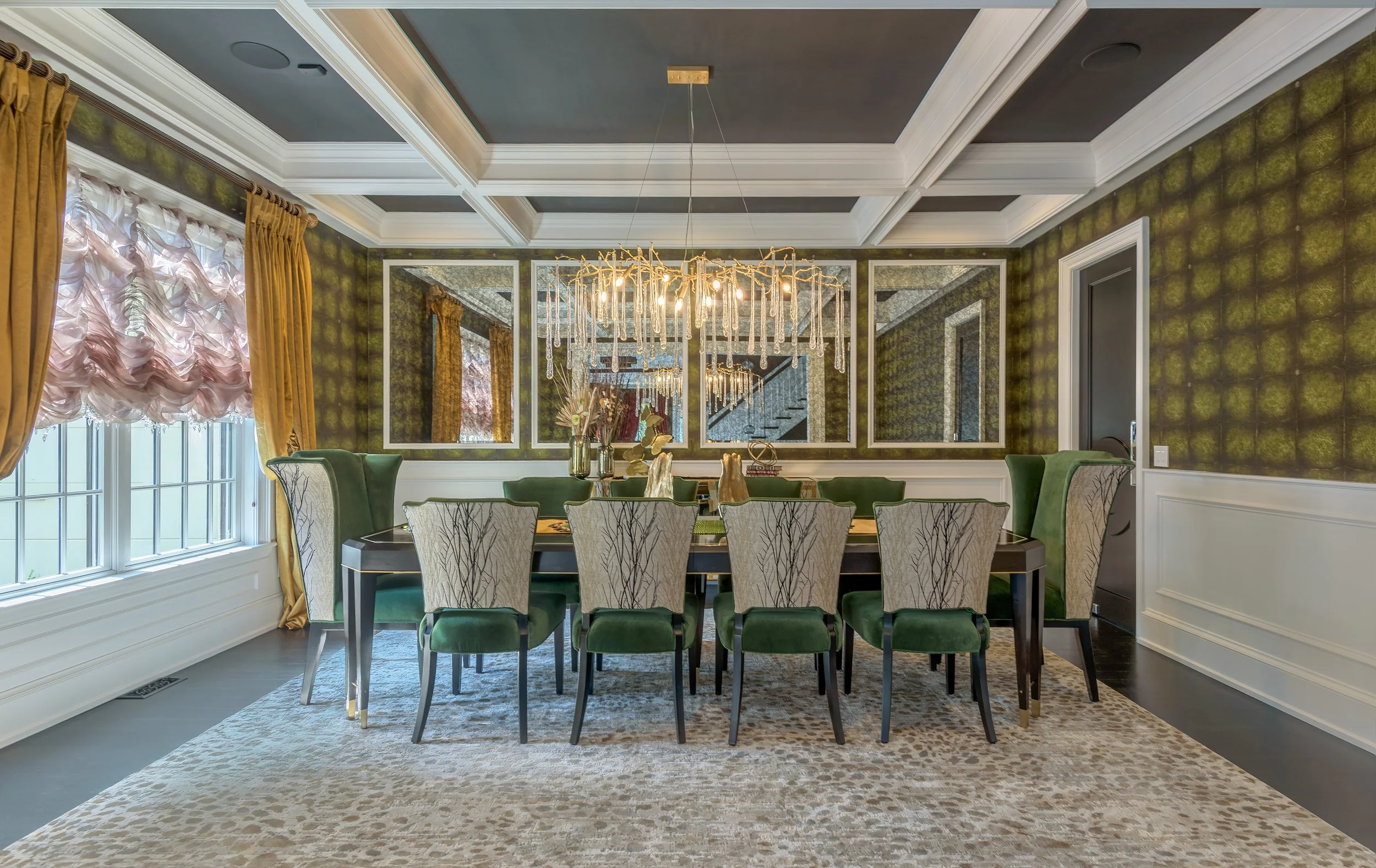 Architectural interior photograph of a formal dining room featuring coffered ceilings, custom wall finishes, mirrored panels, and a contemporary chandelier.