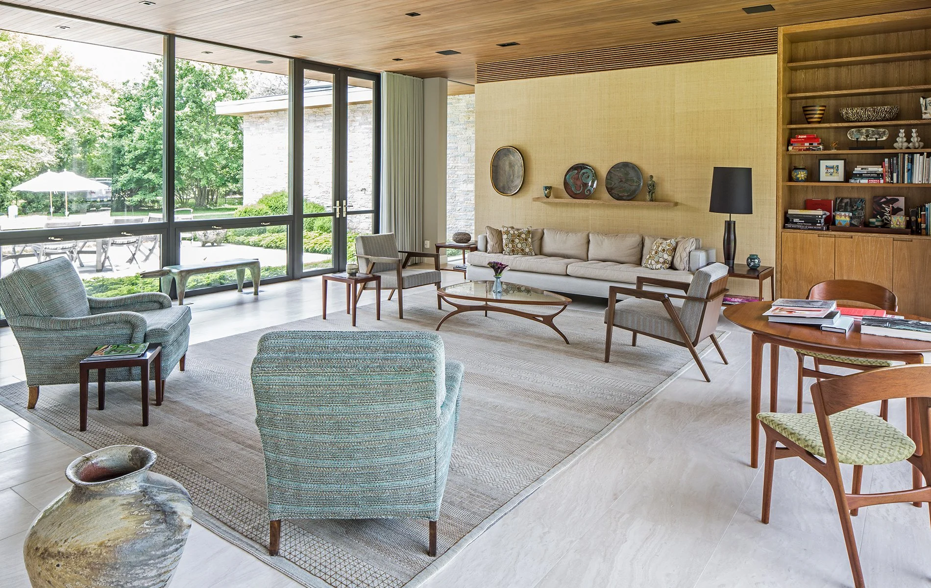 Modern living room glass walls wood ceiling Hamptons