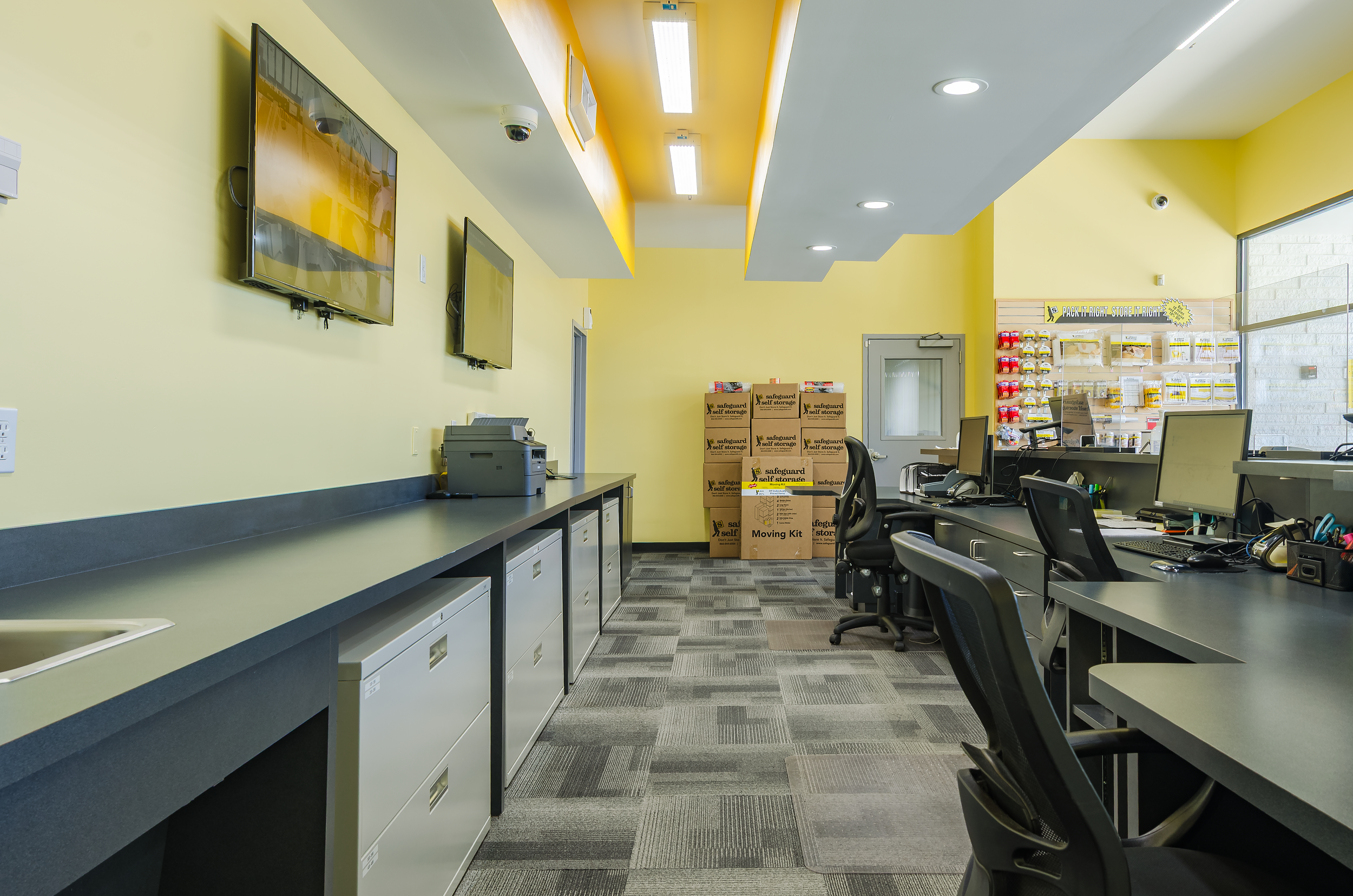Commercial office workspace photographed for business and municipal clients in NYC, Queens, and Long Island, featuring modern workstations, integrated lighting, and a clean functional interior layout.”