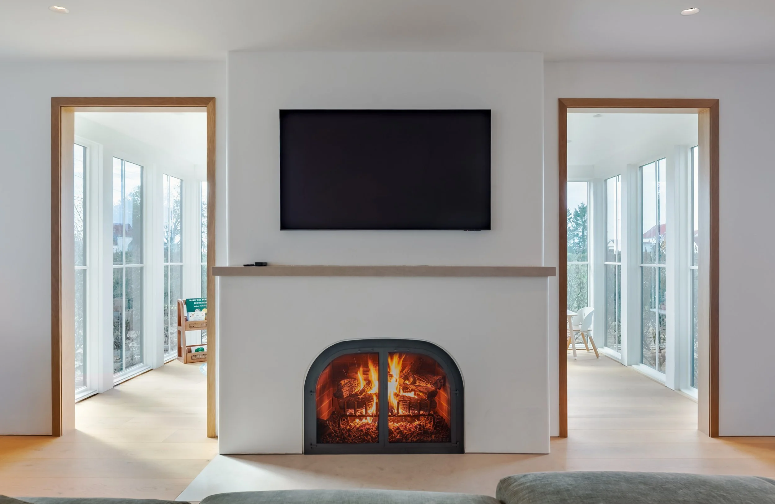 08-north-fork-gut-renovation-living-room-arched-fireplace.jpg