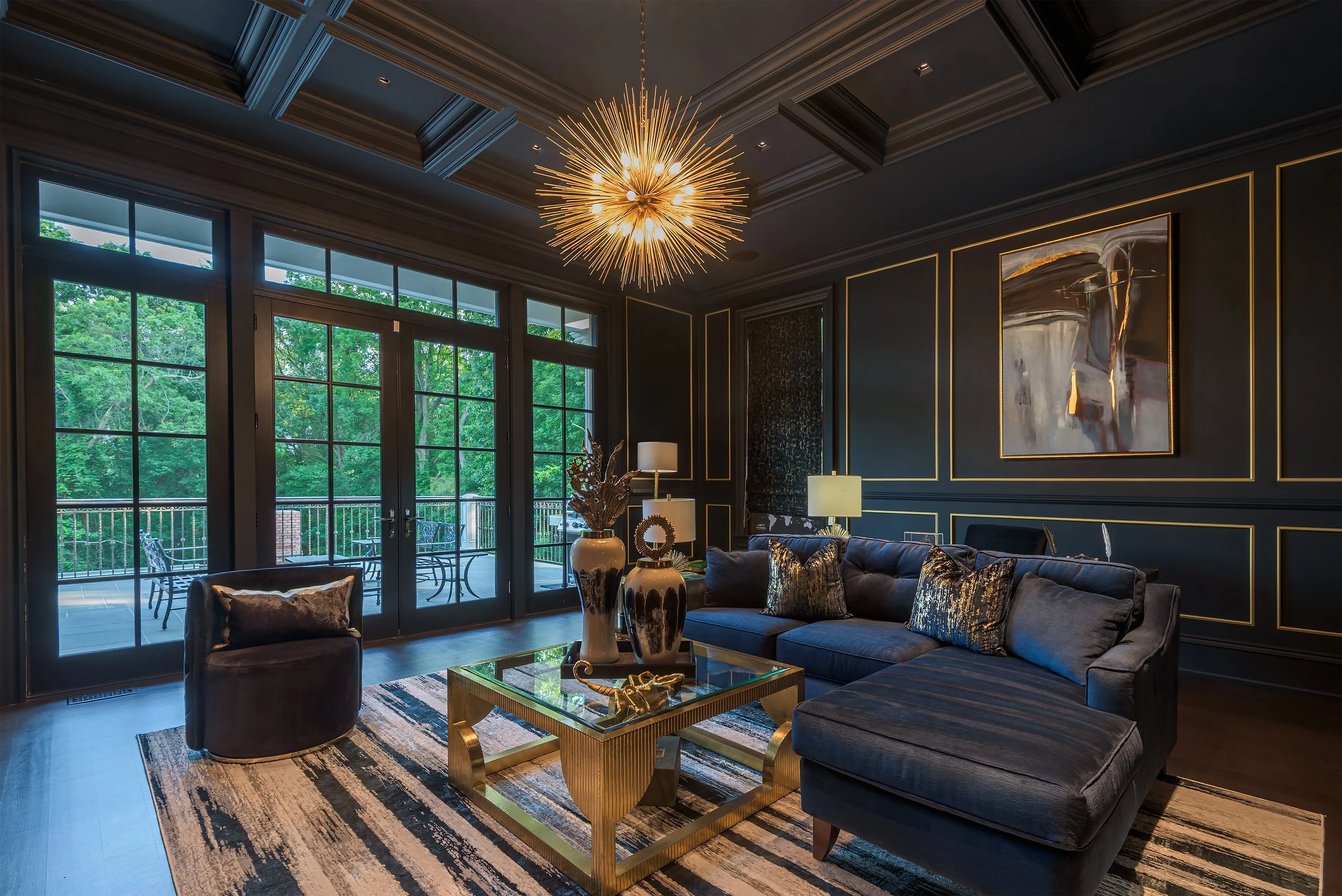 luxury architectural interior suitable for commercial and residential use, featuring dark paneled walls, coffered ceiling, statement chandelier, and refined seating layout.