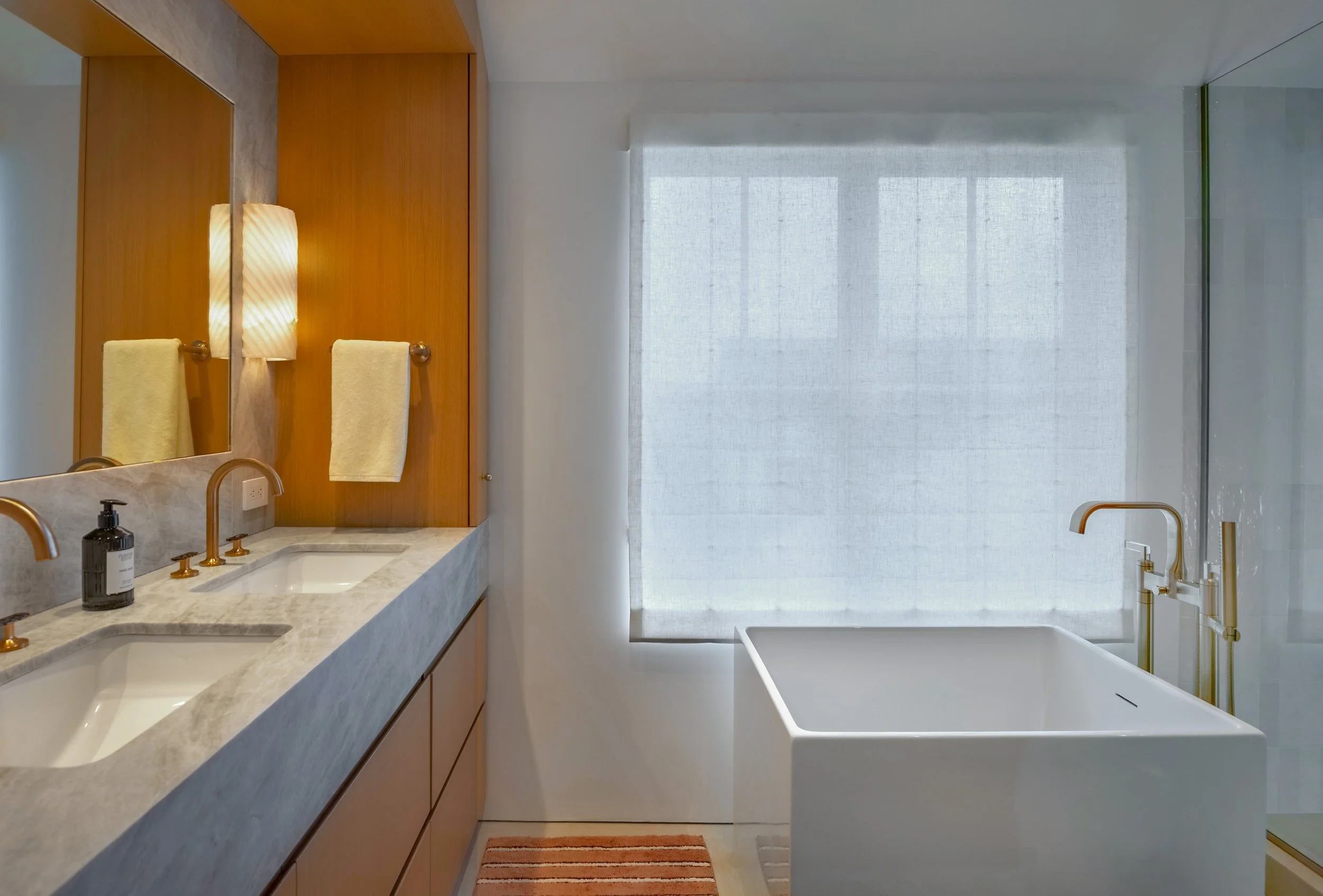 12-north-fork-gut-renovation-primary-bathroom-soaking-tub-double-vanity.jpg