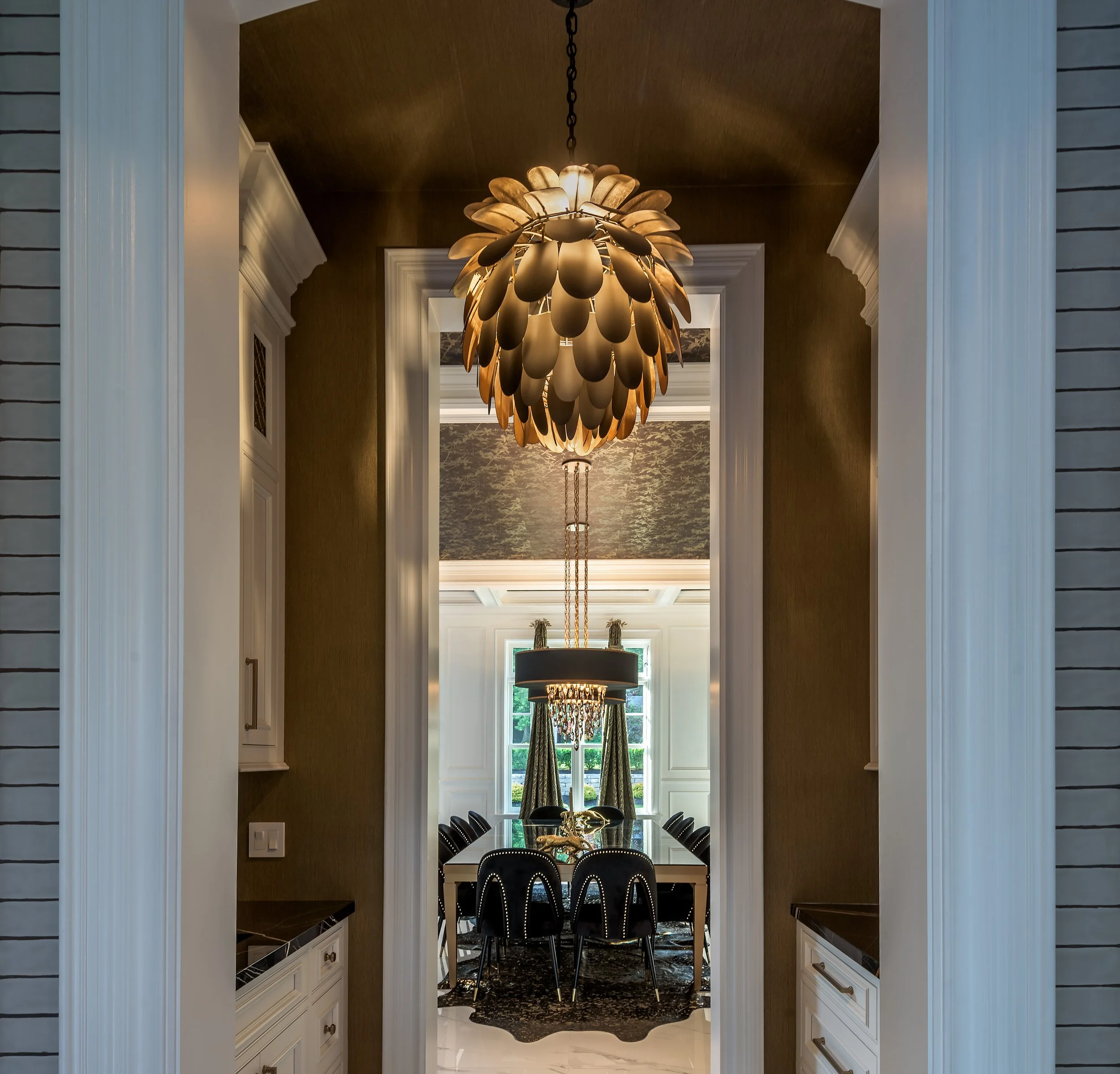 Commercial architectural lounge interior with exposed brick wall, natural light, modern seating, and greenery in a refined hospitality-style space