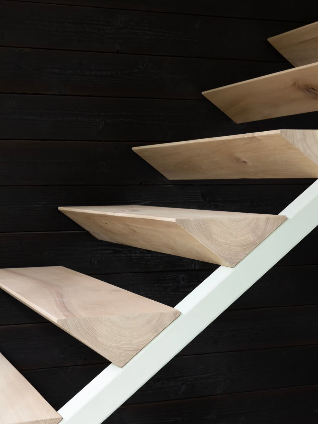 Floating. Suspended. Solid wood.

The exposed end grain reveals the tree rings in section &mdash; turning each stair tread into a record of time and growth.
.
.
.
.
.
.
.
.
.
.
#TimberArchitecture #TextureAndMaterial #ArchitecturalCraft #woodarchitec