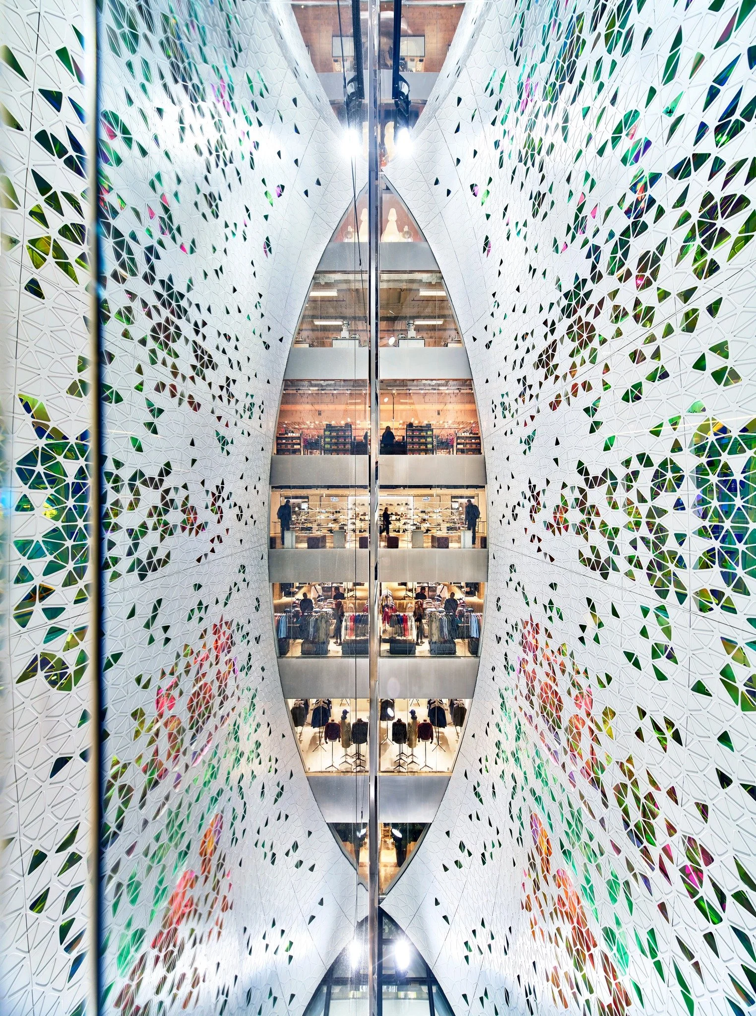 Springtime memories of working in the heart of Paris.

For Printemps Haussmann, we were invited to reimagine a grand vertical circulation space within one of the city&rsquo;s most historic department stores. Conceived as a contemporary veil suspended