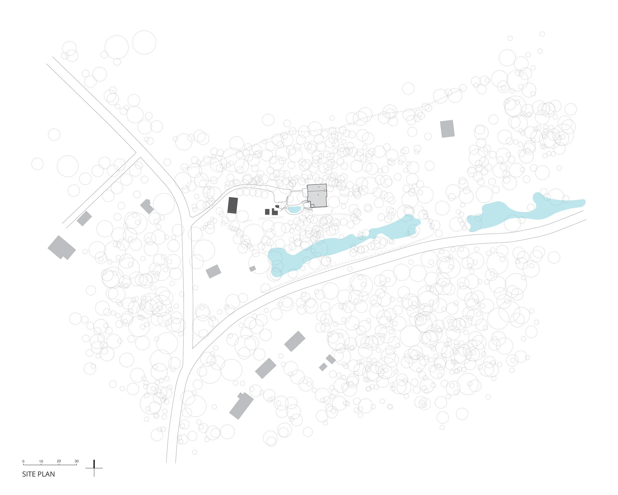 Site plan of a landscape with trees, a pond, buildings, and roads.