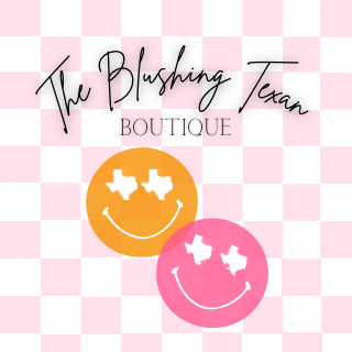 Logo for The Blushing Texan Boutique featuring pink and orange smiley faces with white star-shaped eyes on a pink and white checkered background.