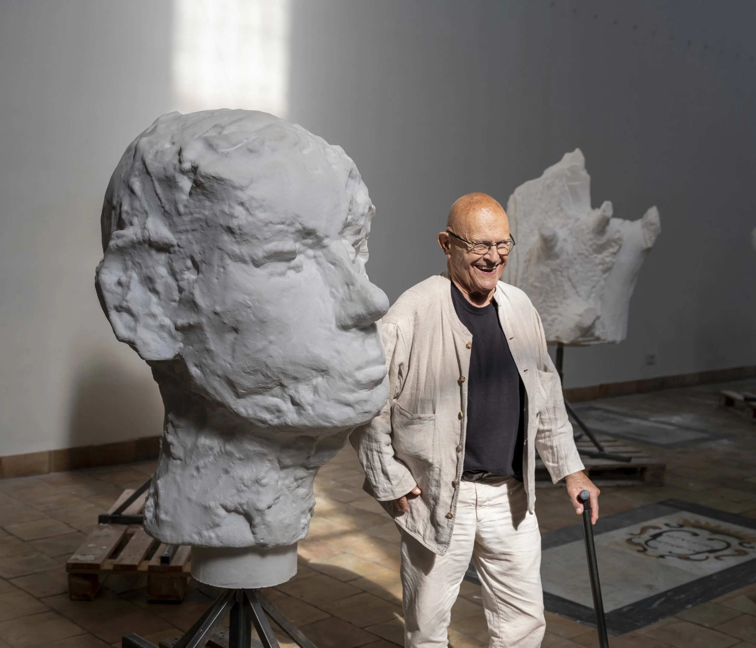 Jim Dine in front of plaster head at his new exhibition Elysian Fields