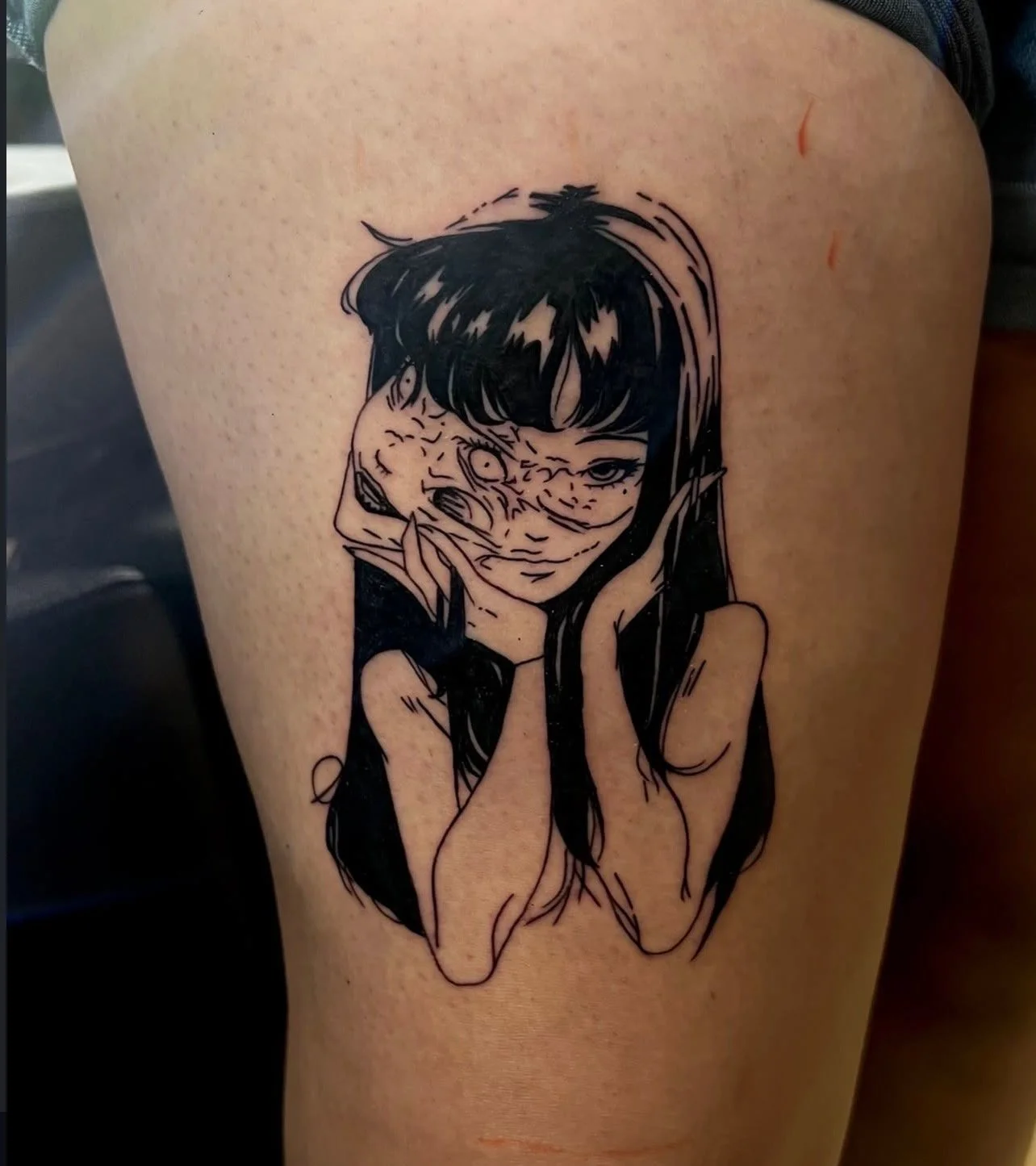 Tattoo of a woman with long dark hair, holding a mask, with a serious expression, in a black and white line art style by Mando at Harp and Rose Tattoo in Ventura California