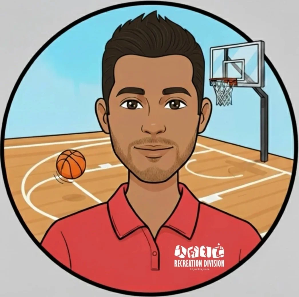 Cartoon of a man with brown hair and a light beard wearing a red polo shirt with 'Recreation Division' printed on it. He is standing in a basketball court with a basketball and a hoop in the background.