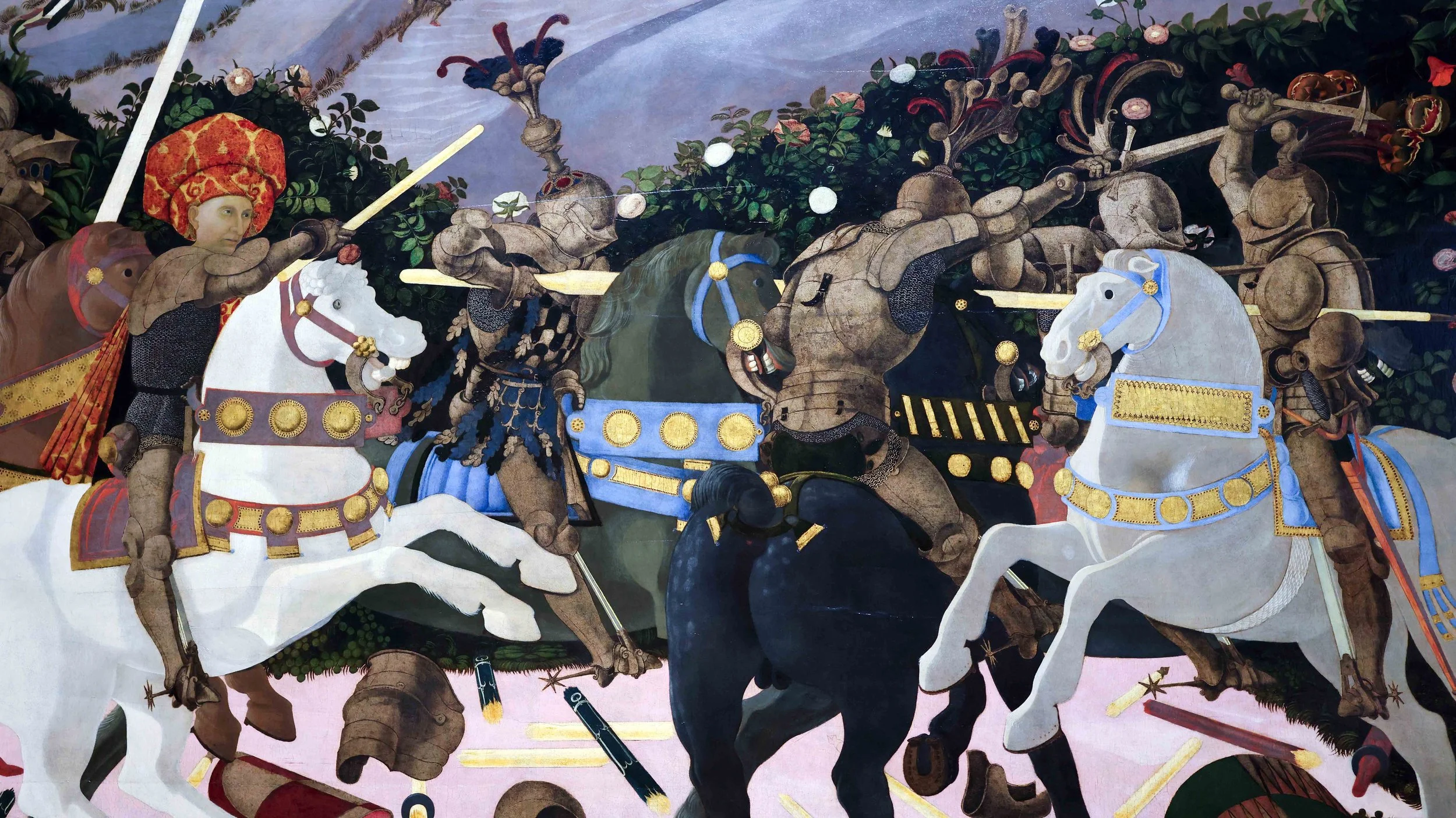 A large wall painting showing people in a battle on horseback