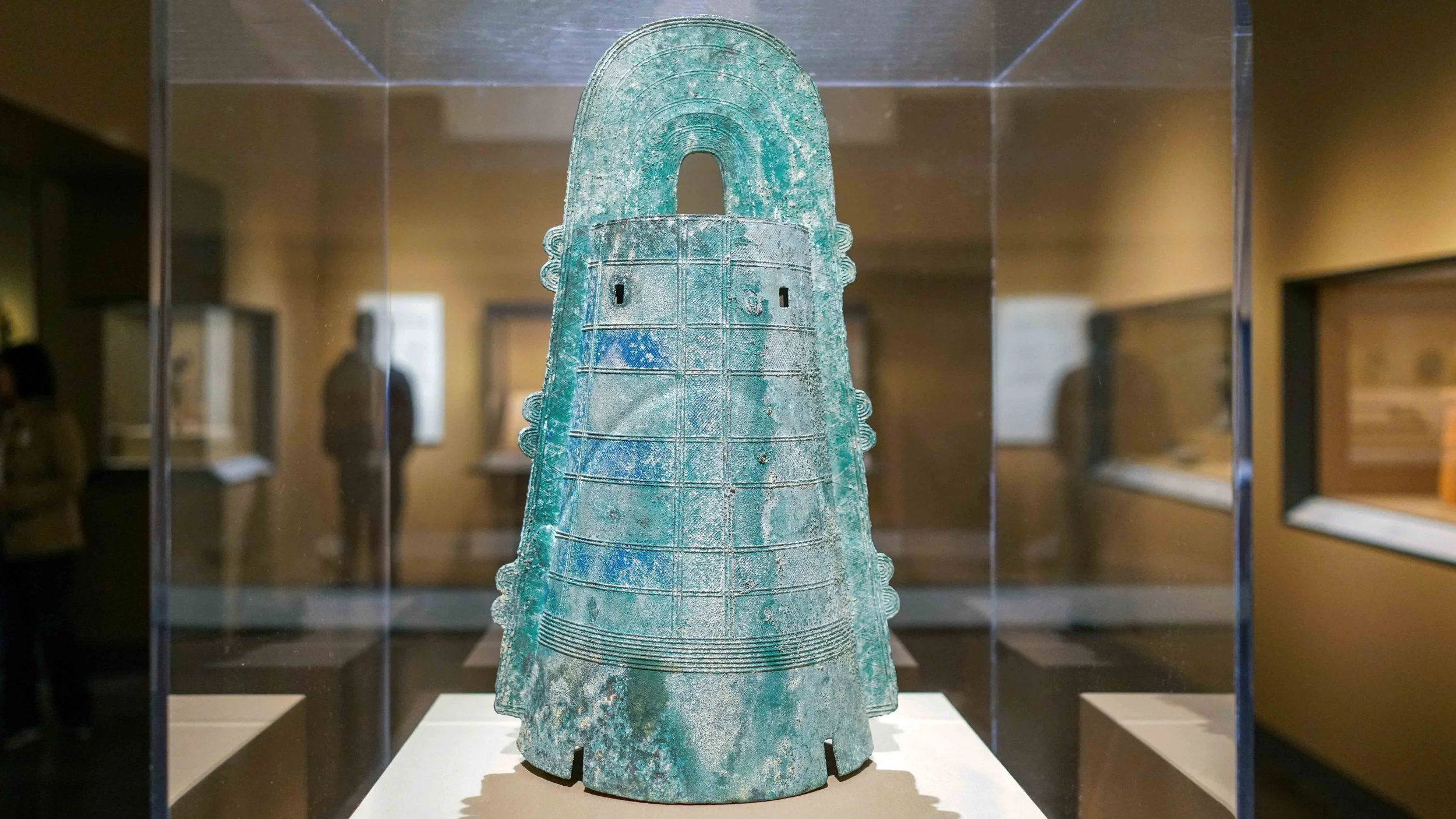 A bronze bell with a round top