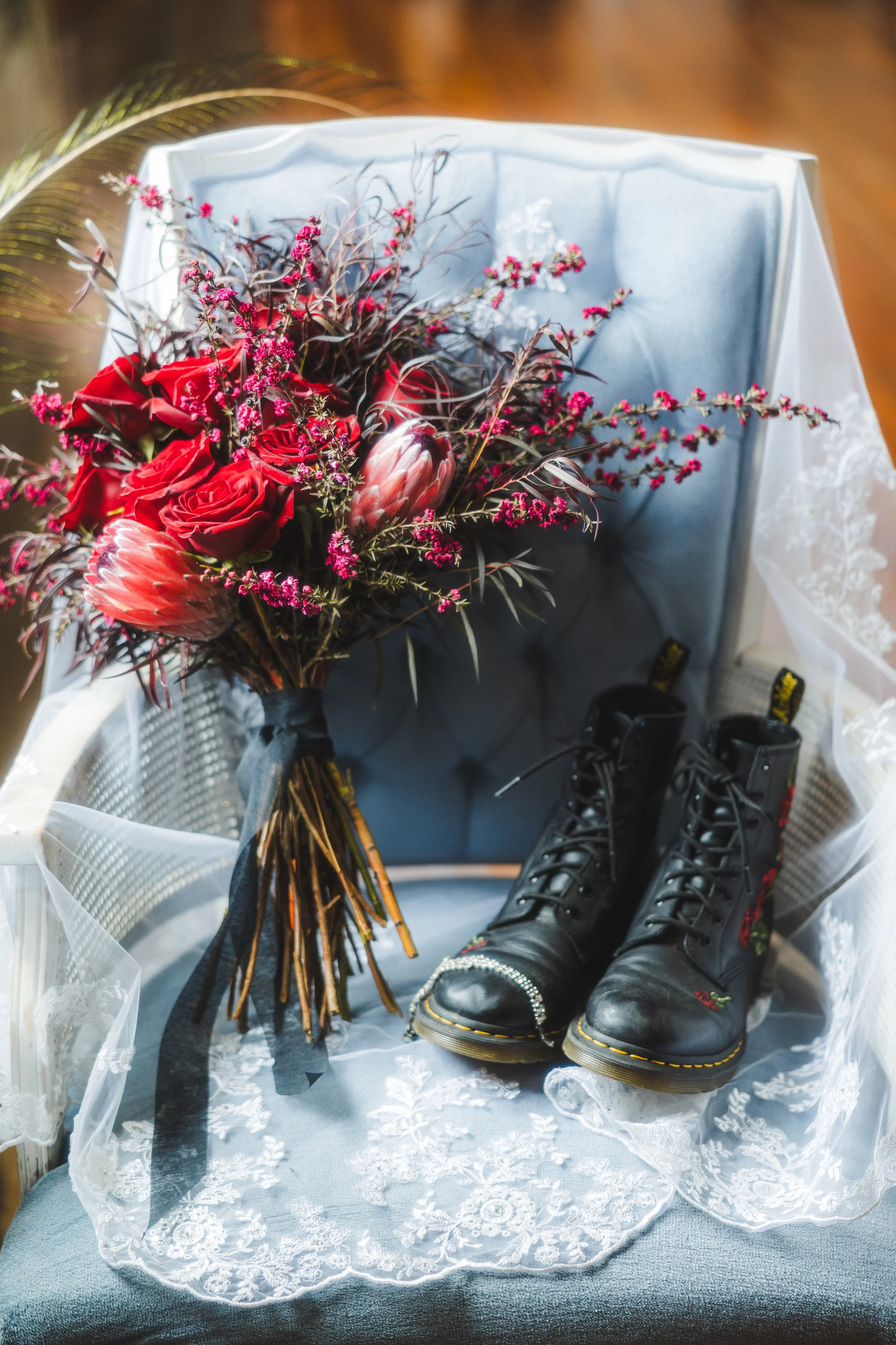 Bridal Bouquet on blue velvet chair covered with bridal veil. 
Florals: Chemical Ocean Studio
Veil: Exclusively Bridal
Chair: BirdieJune Events and Rentals
Photographer: Katy Nevinsky
