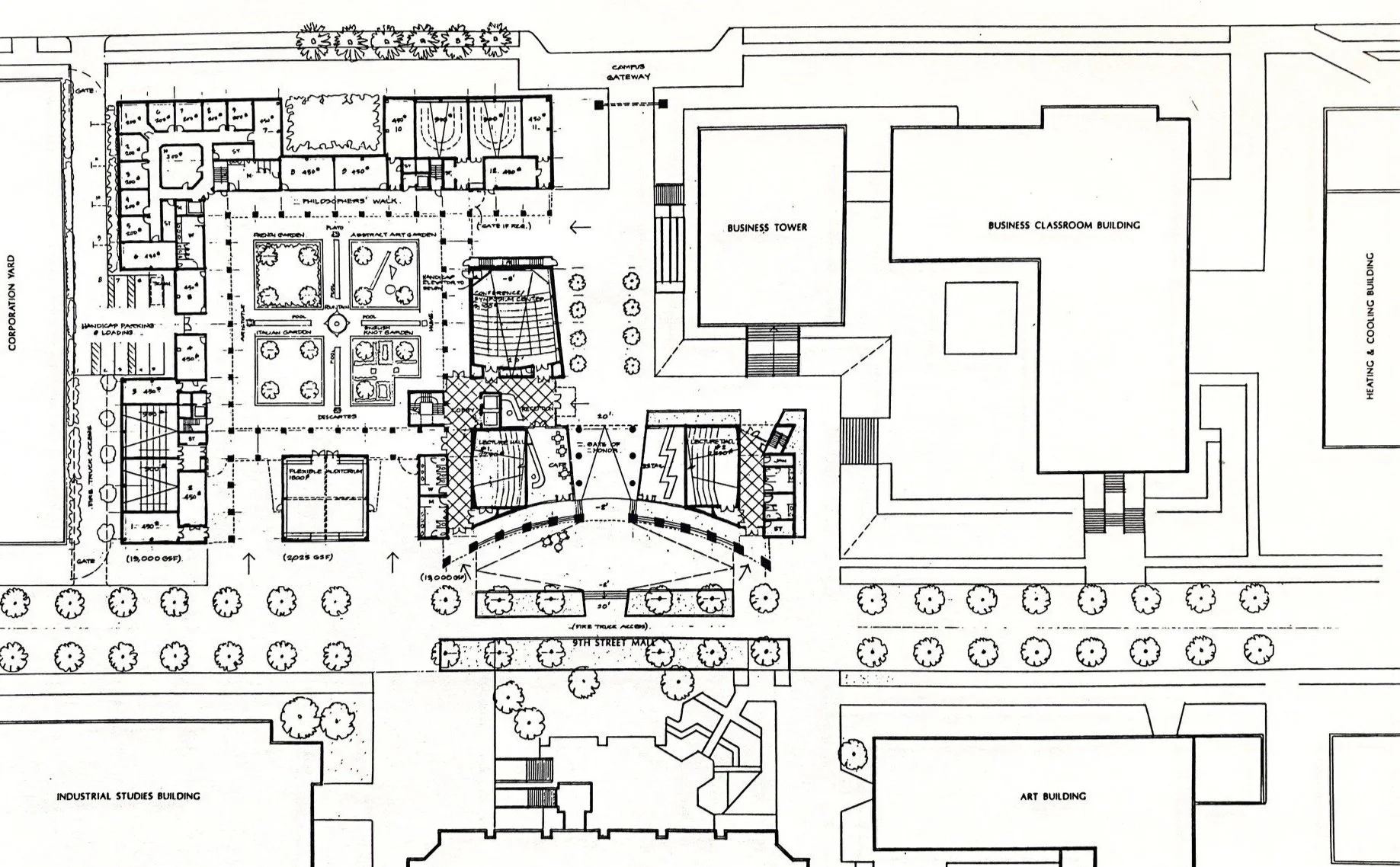 The building acts as a gateway to the campus and contains lecture halls, faculty offices and a library arranged around a courtyard.