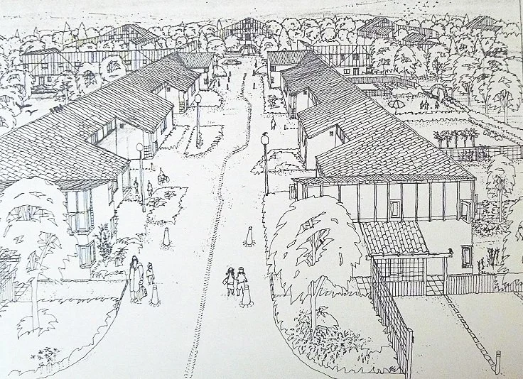 View down one of the shared streets leading to the taller buildings against the main road. 