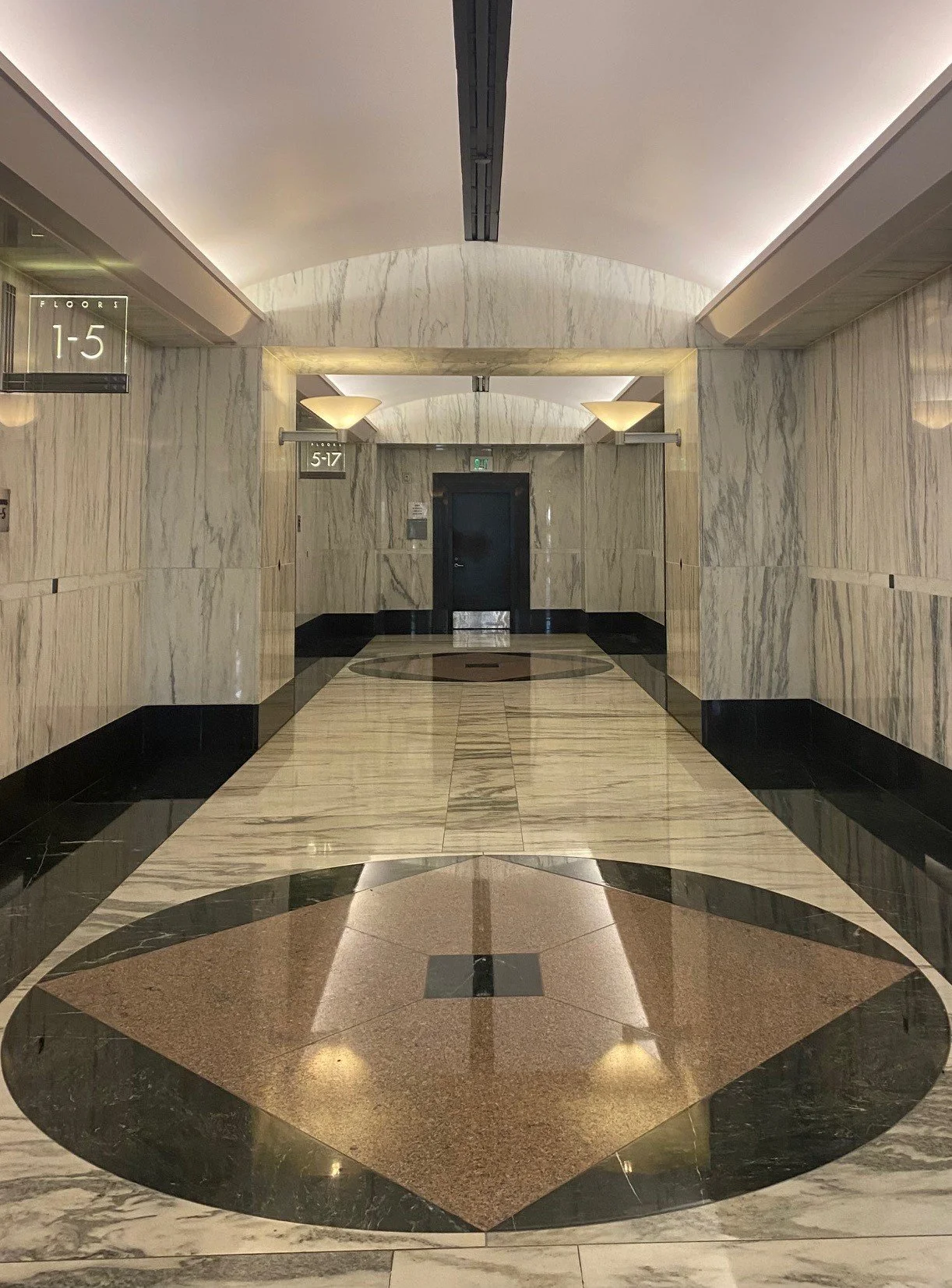 Entry lobby corridor leading to the elevator lobbies.