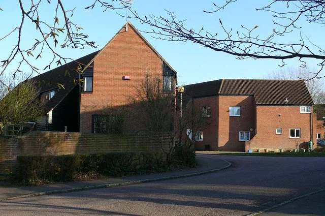 Houses turn the corners to maintain the street wall.