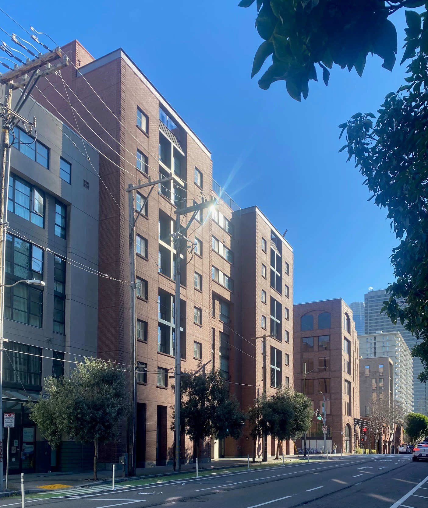 View down Battery Street showing the relationship with the brick-clad office building on the other side of Broadway.