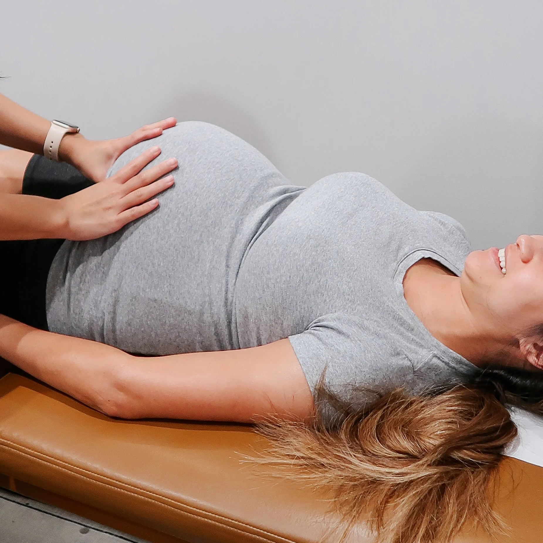 Pregnant woman receiving gentle Webster Technique chiropractic care in Cypress, TX