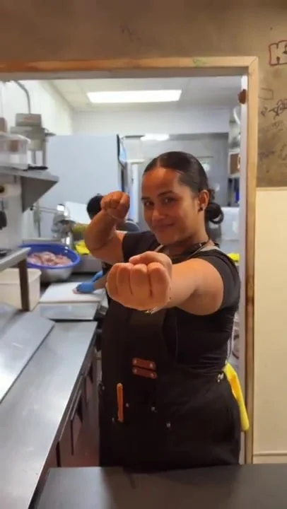 A Sura team member playfully posing in our kitchen