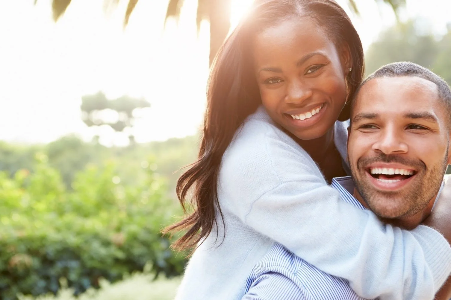 Smiling couple embracing, representing intimacy and hormone health