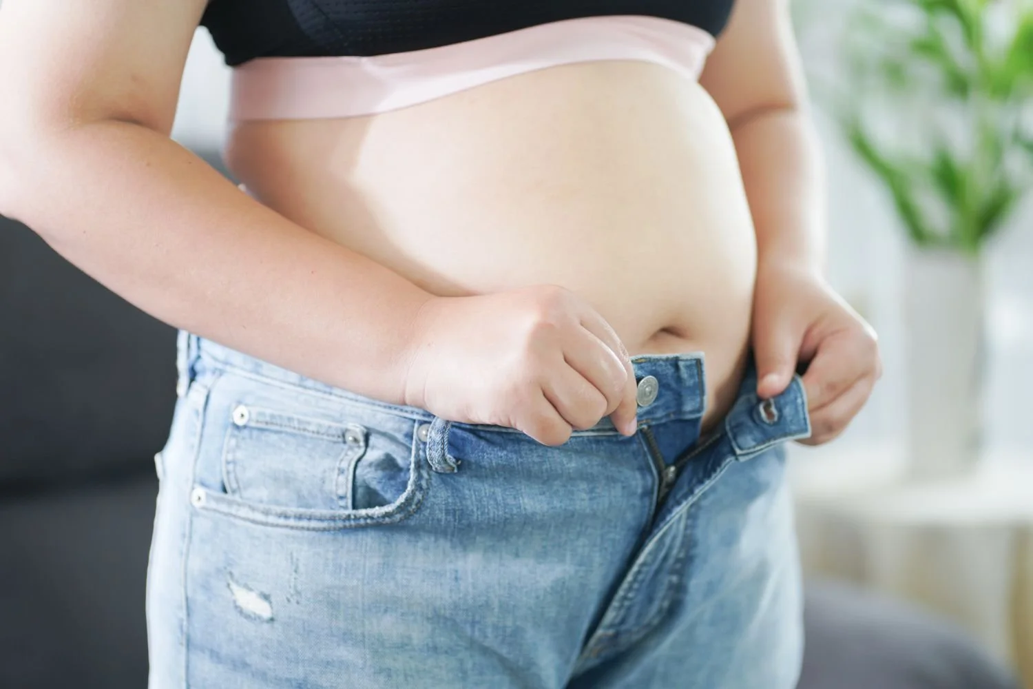 Woman with digestive discomfort seeking gut health care in Brandon, FL