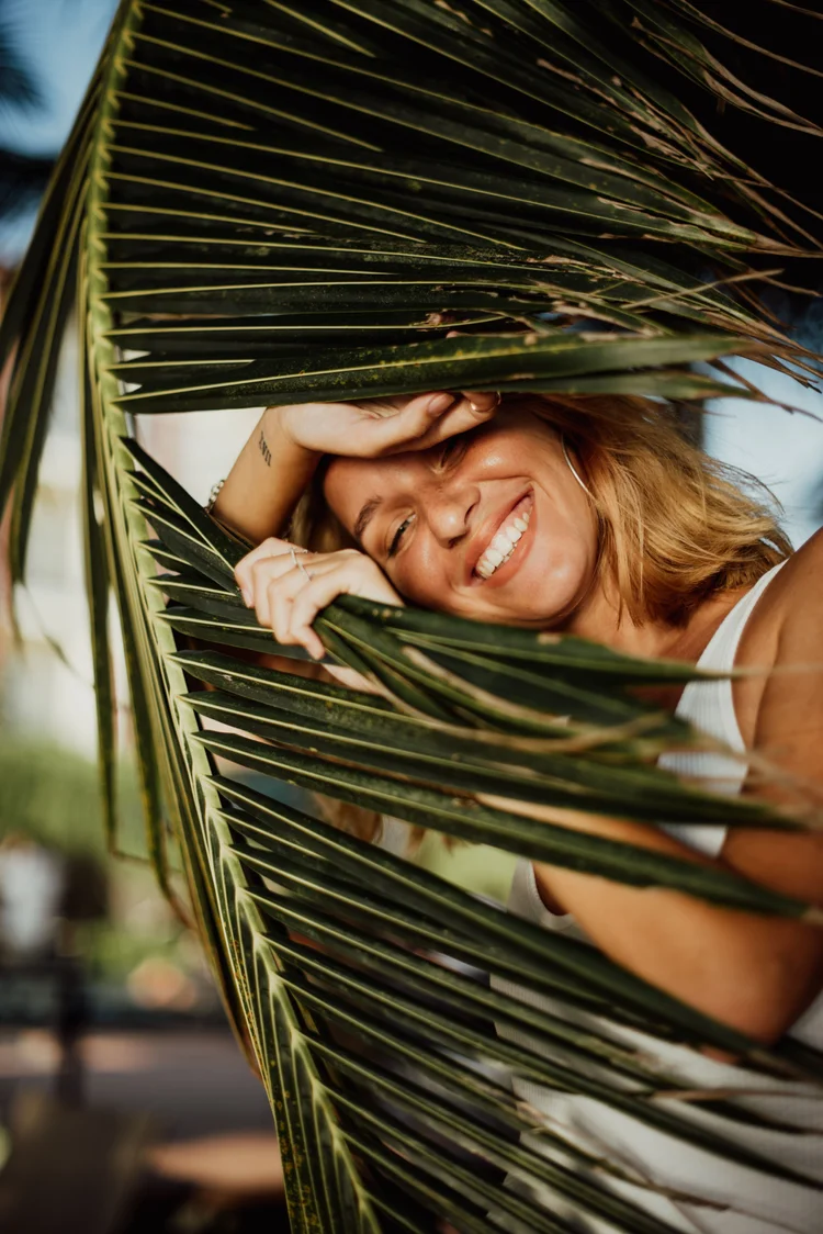 Woman smiling outdoors, feeling well