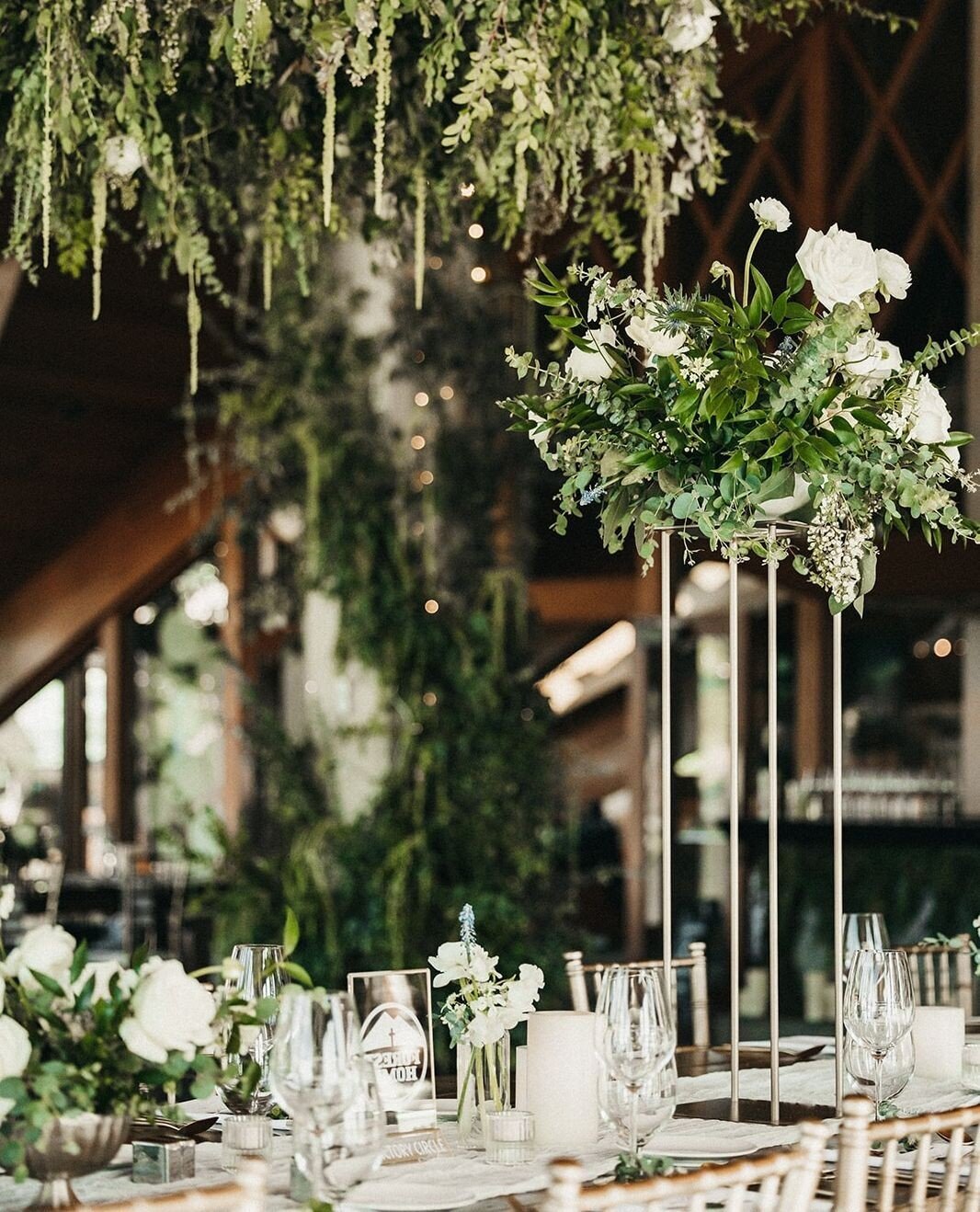 Filling your reception space with lush greenery and transforming into a world out of the one we know is something we highly recommend almost no matter what your venue is. ⁠
.⁠
Planner: @beauandarroweventco⁠
Catering: @edgewoodtahoe⁠
Cake/Dessert: @fl