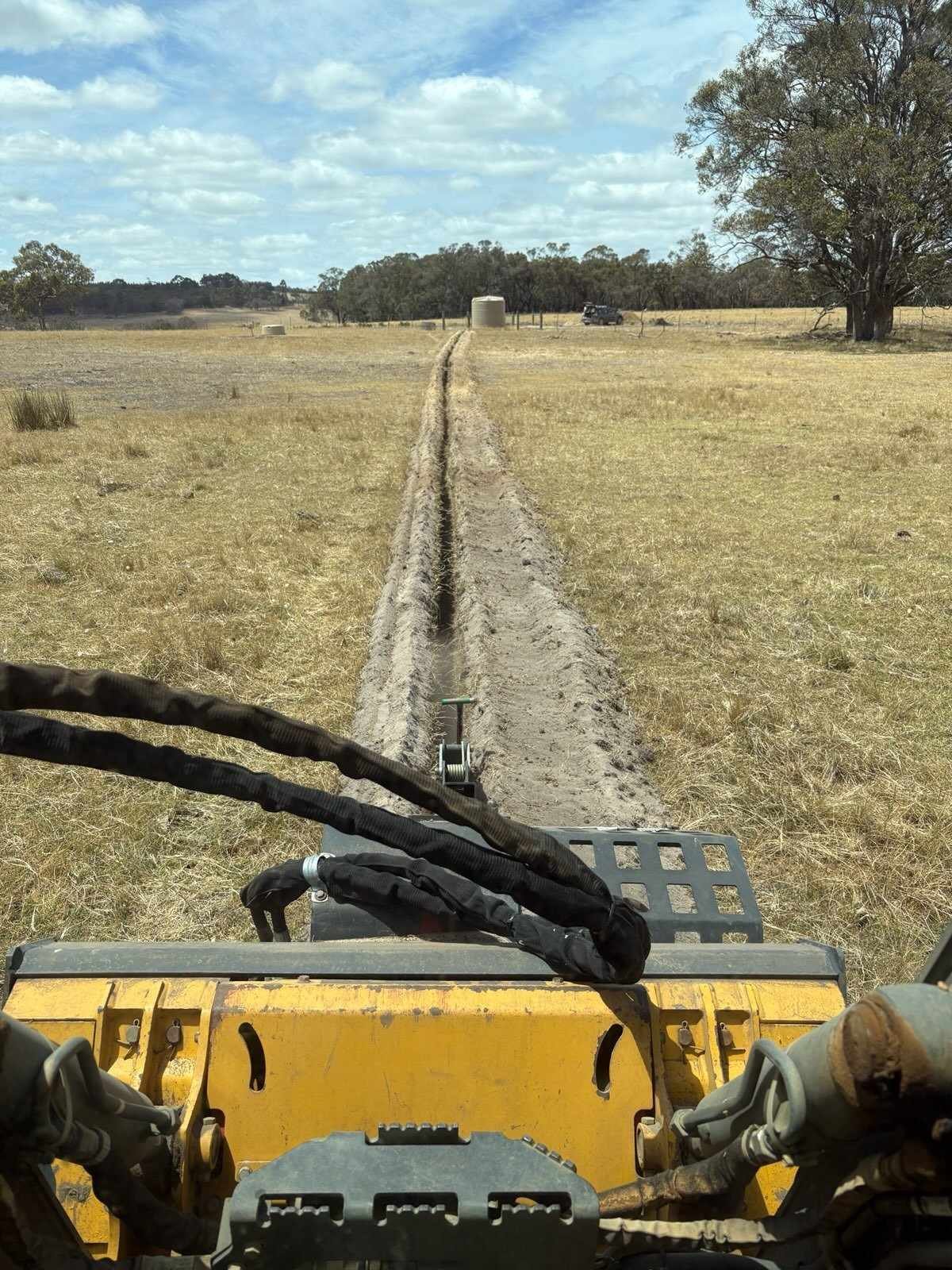 trenching for a pipeline to trough
