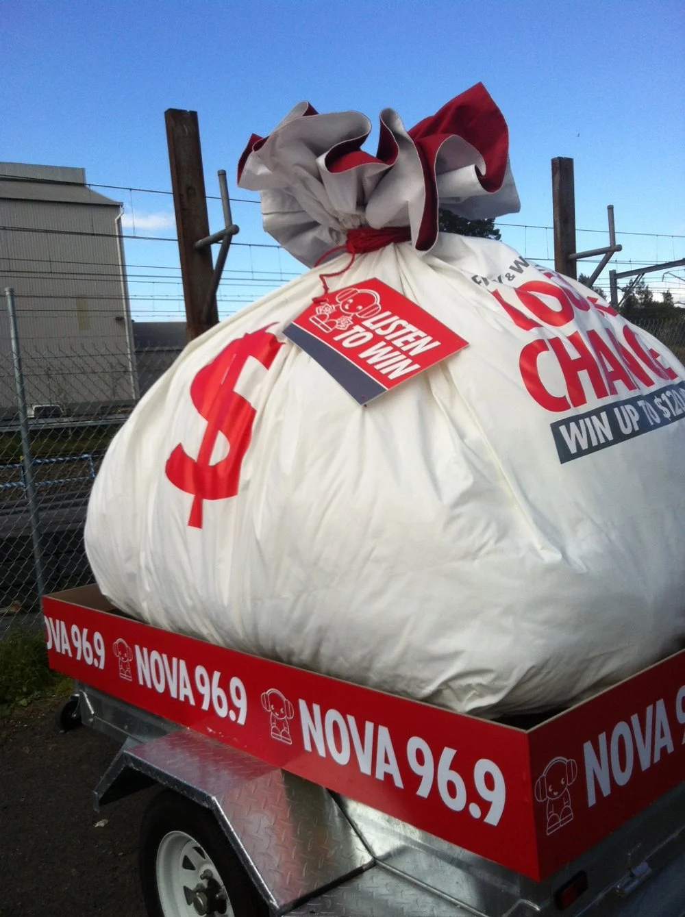 giant money bag in trailer radio promotion.JPG