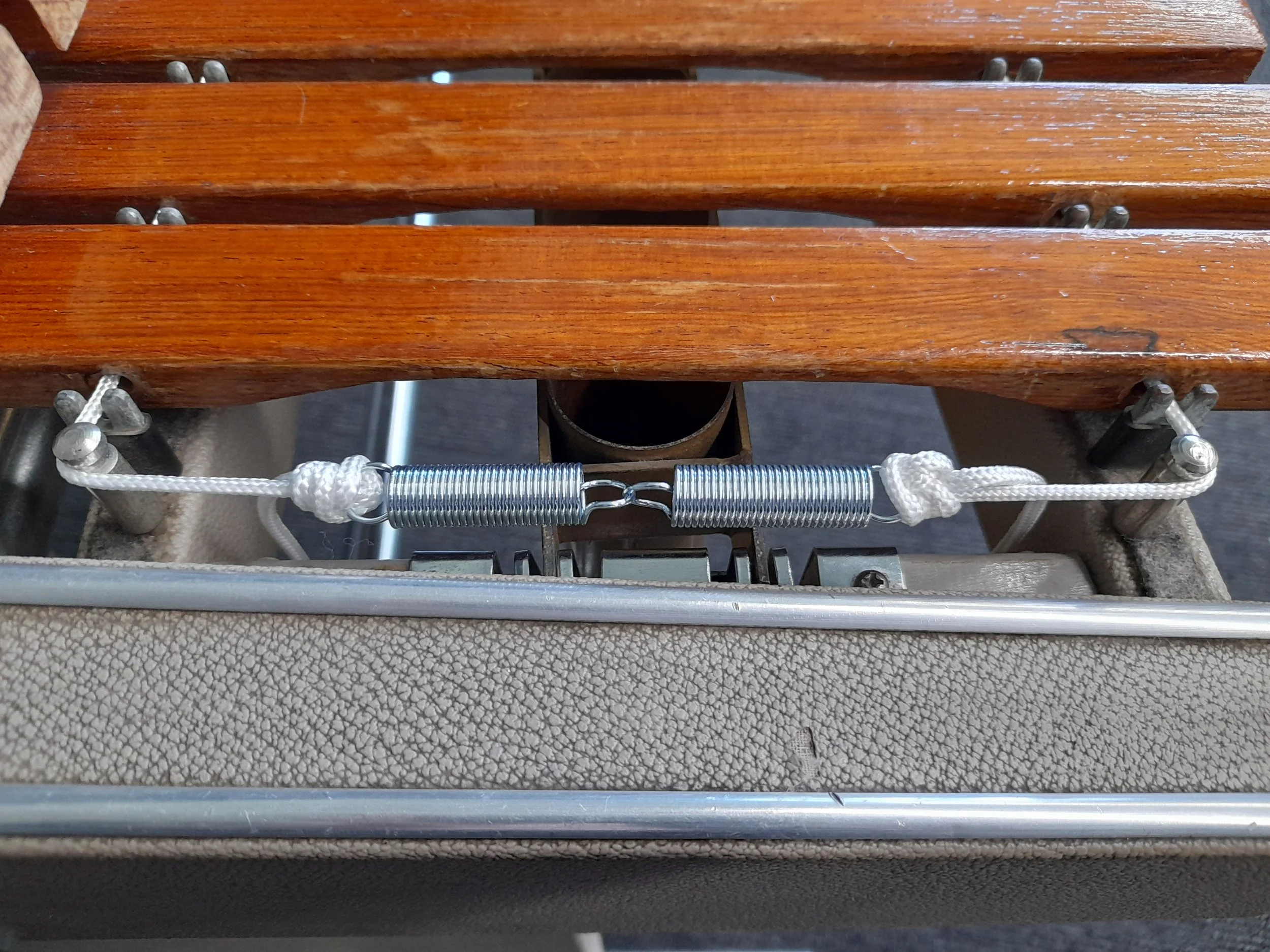 Newly replaced xylophone tensions springs and cord.