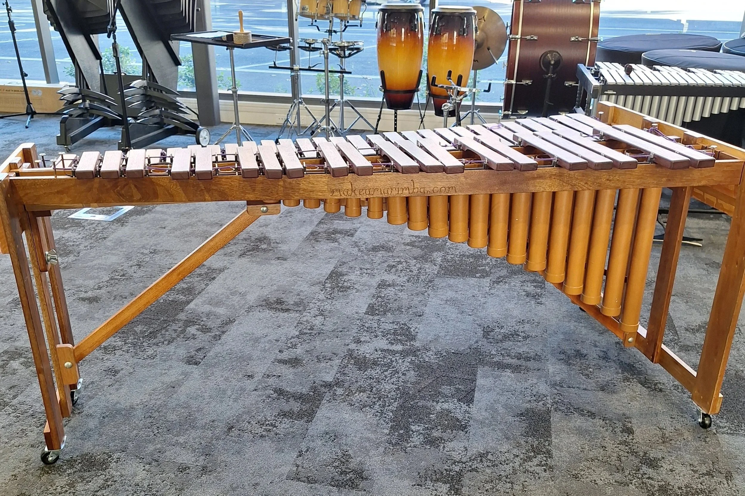 Image of marimba resonators. Notice that the lower notes have larger pipes.