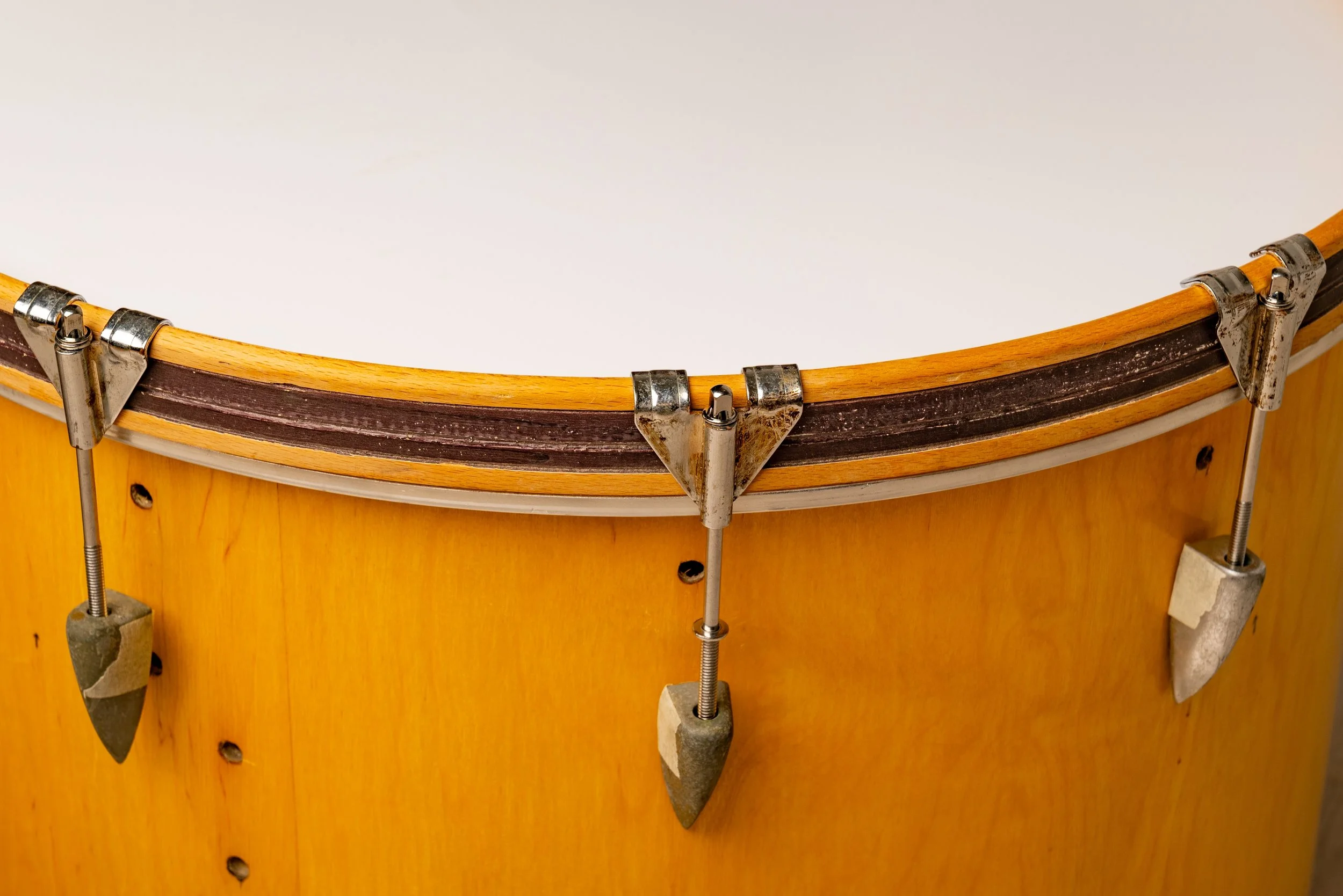 Close-up of a bass drum's rim.