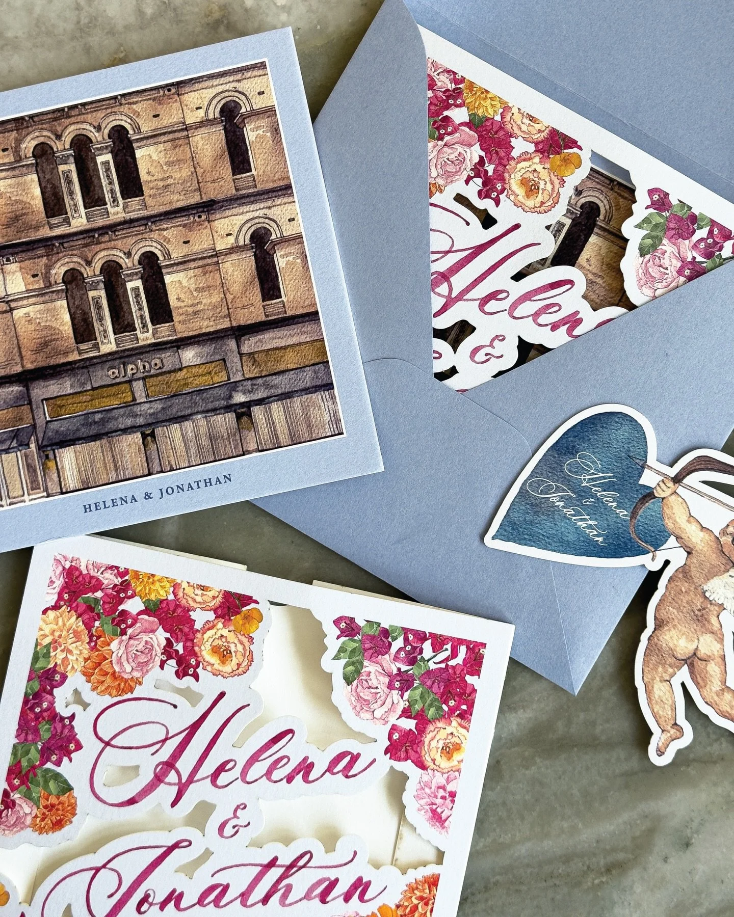 Love is truly in the air for Helena &amp; Jonathan 🩵

An intricate laser-cut sleeve reveals a luxuriously duplexed main invitation, paired with a bespoke laser-cut Eros RSVP.
Swipe to see the magic of the unenveloping unfold, just as a guest would e