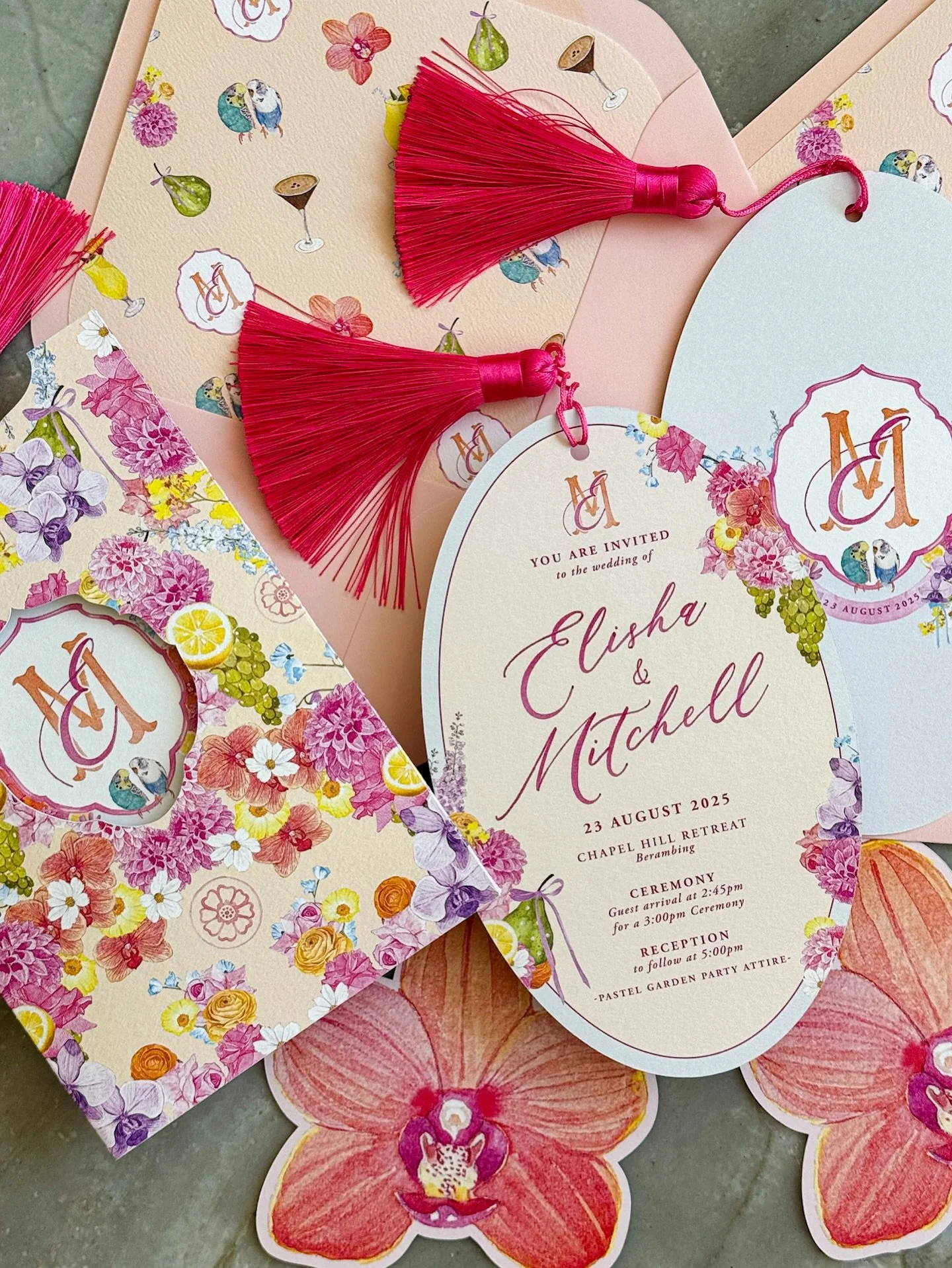 ✨ Letting pastels have their moment ✨
For Elisha &amp; Mitch, who adore every colour of the rainbow, with orchids and pearls woven throughout. Their suite featured a custom floral-patterned sleeve to keep all the pieces together, and cutout orchids f