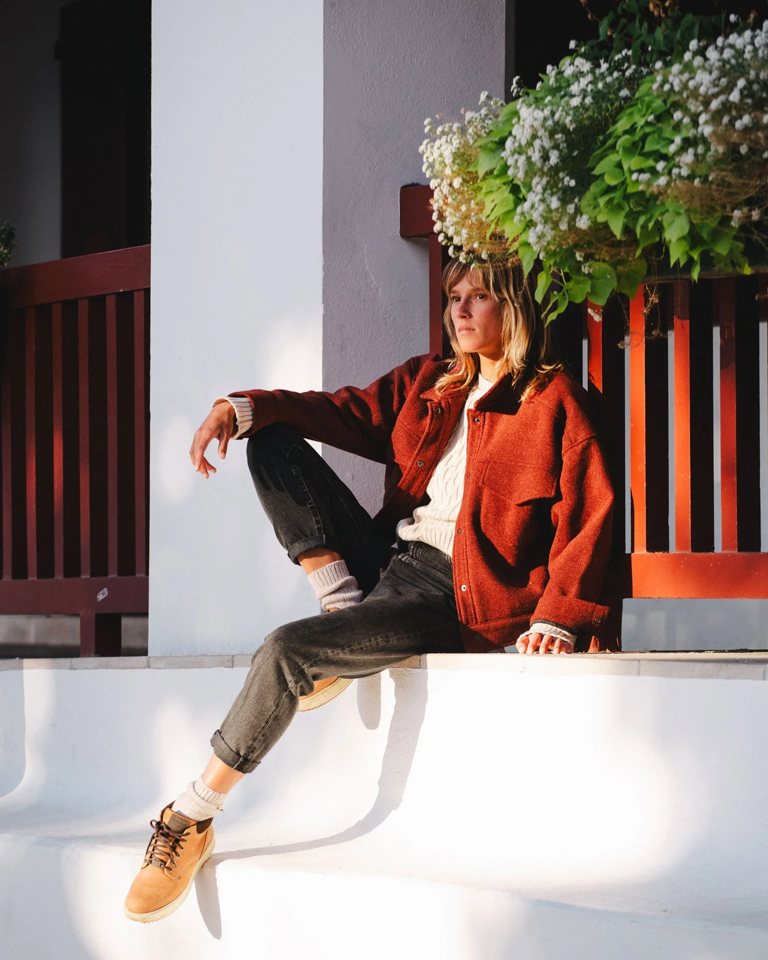Lifestyle fashion photograph created in Biarritz for TwoThirds by Karl Mackie, blending warm evening light, coastal architecture and relaxed editorial storytelling.